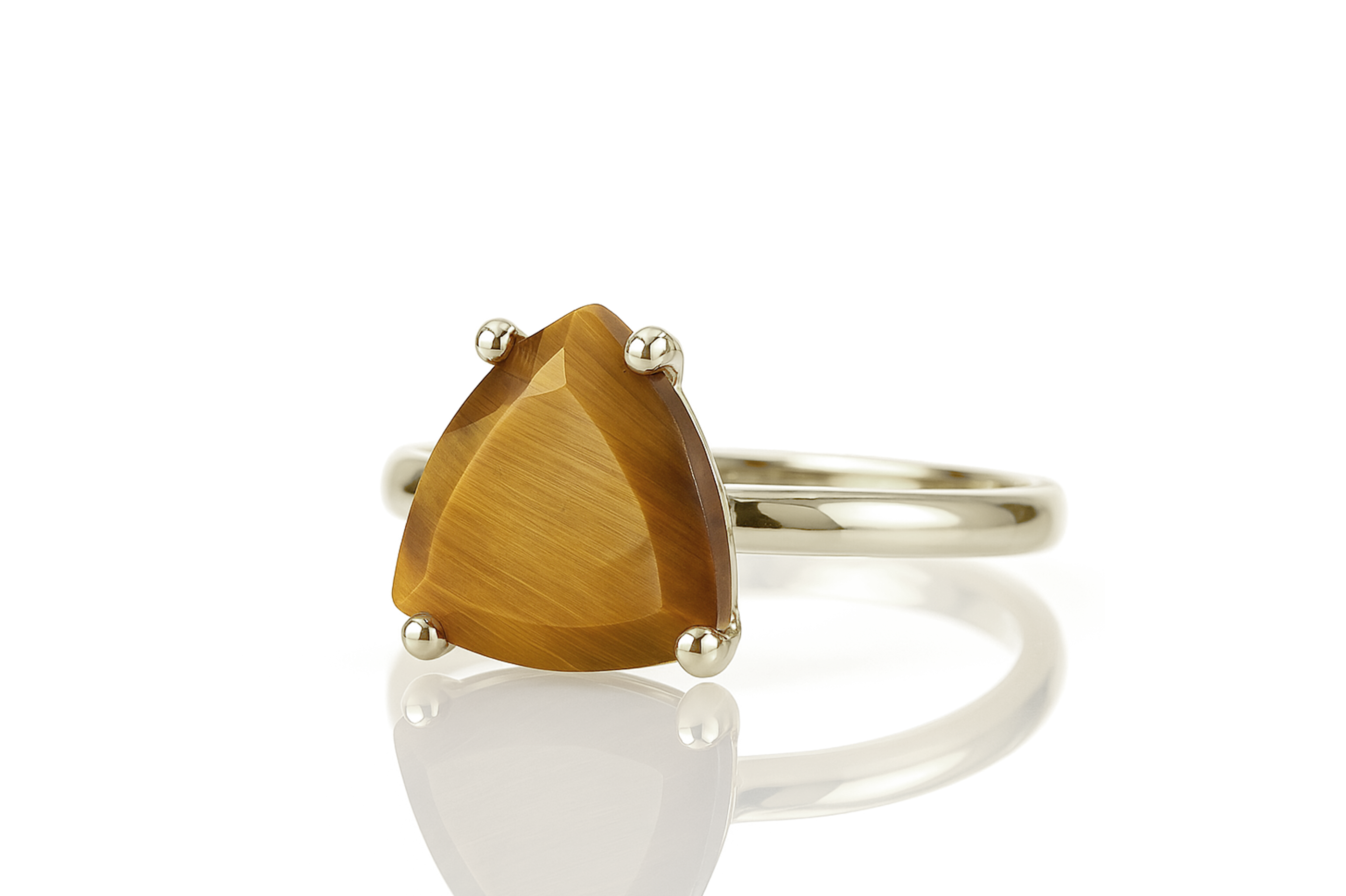 a ring with a pear shaped brown stone