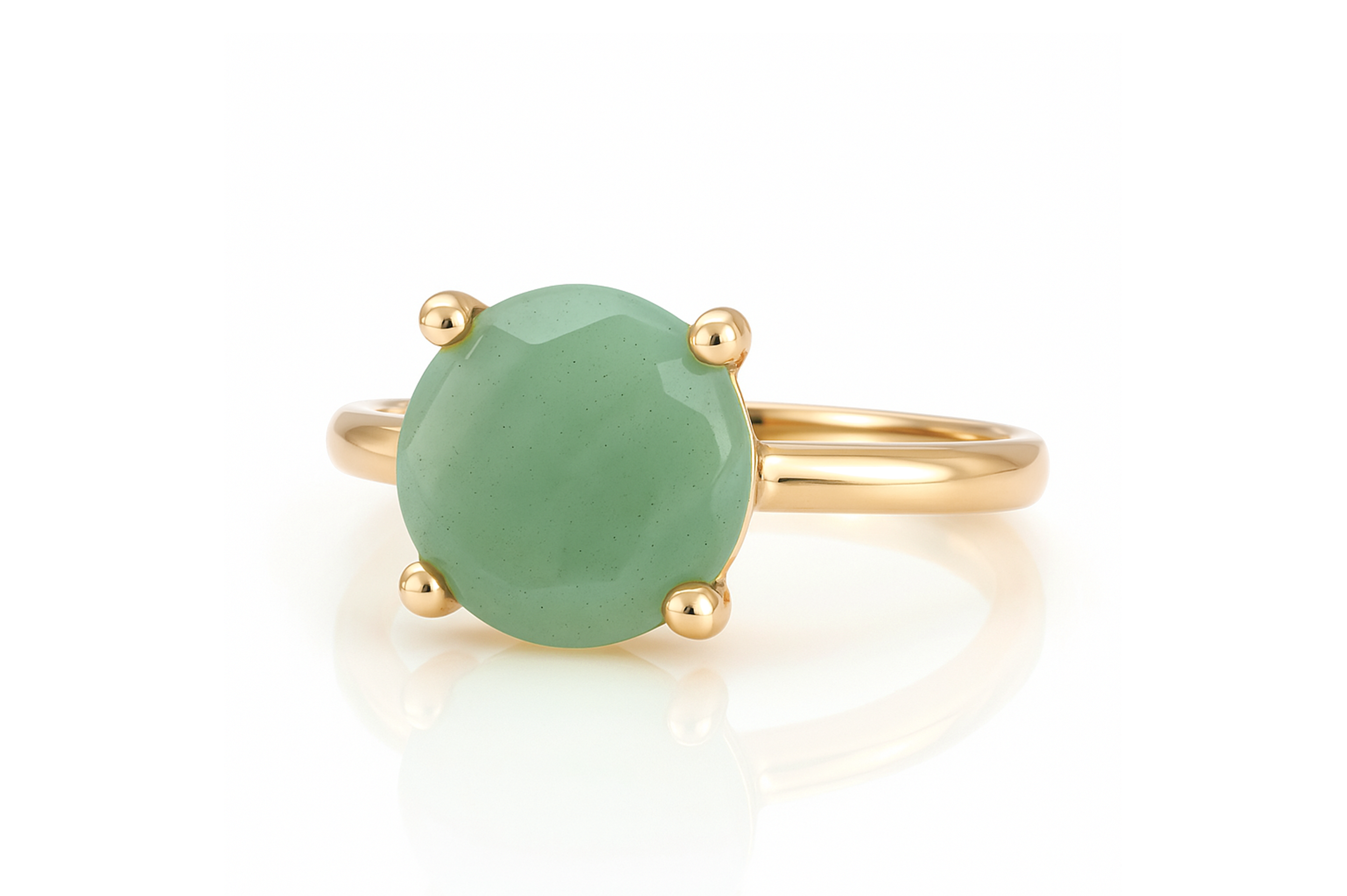 a gold ring with a green stone on it