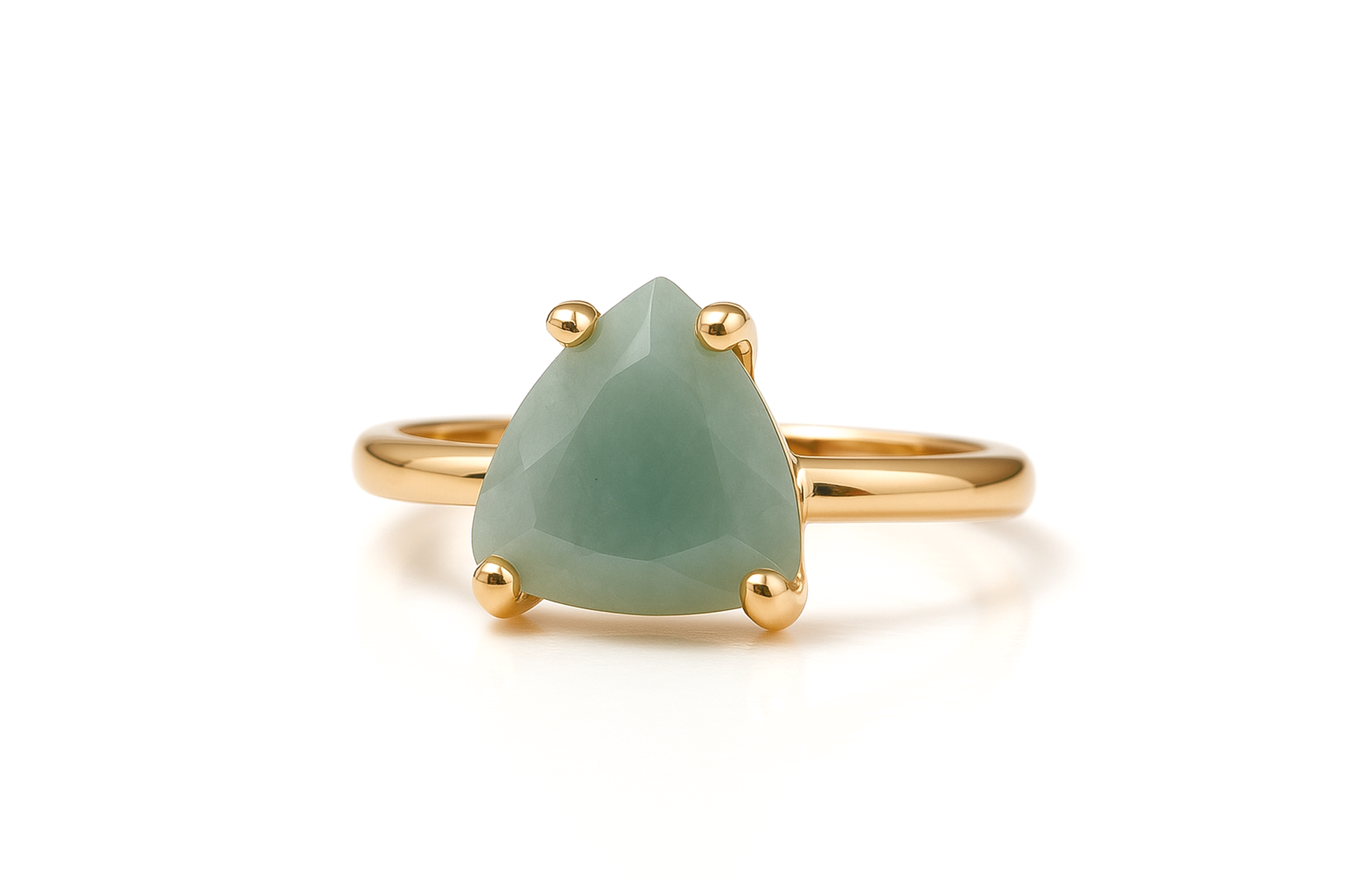 a gold ring with a green stone on it