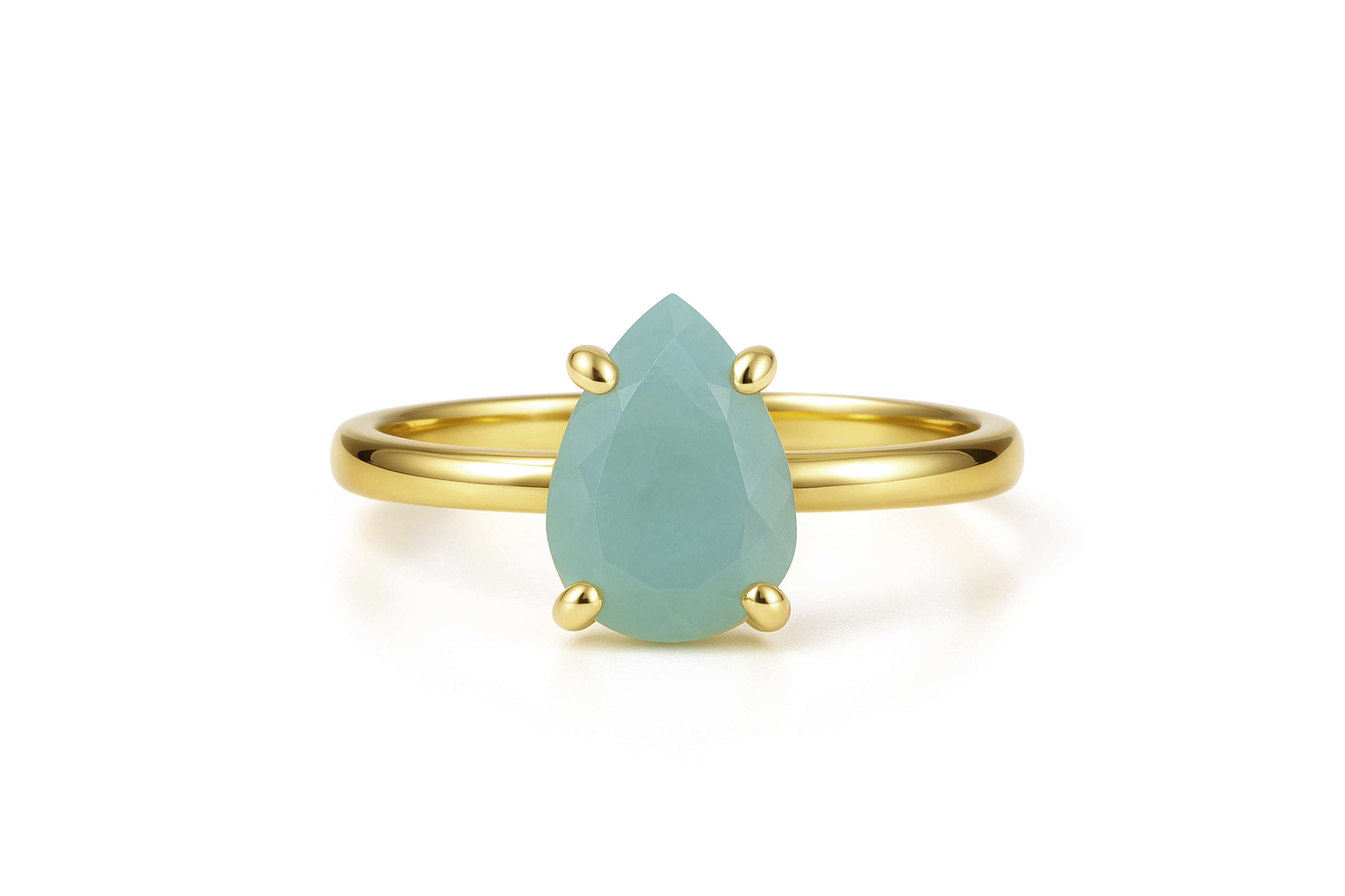 a gold ring with a pear shaped green stone