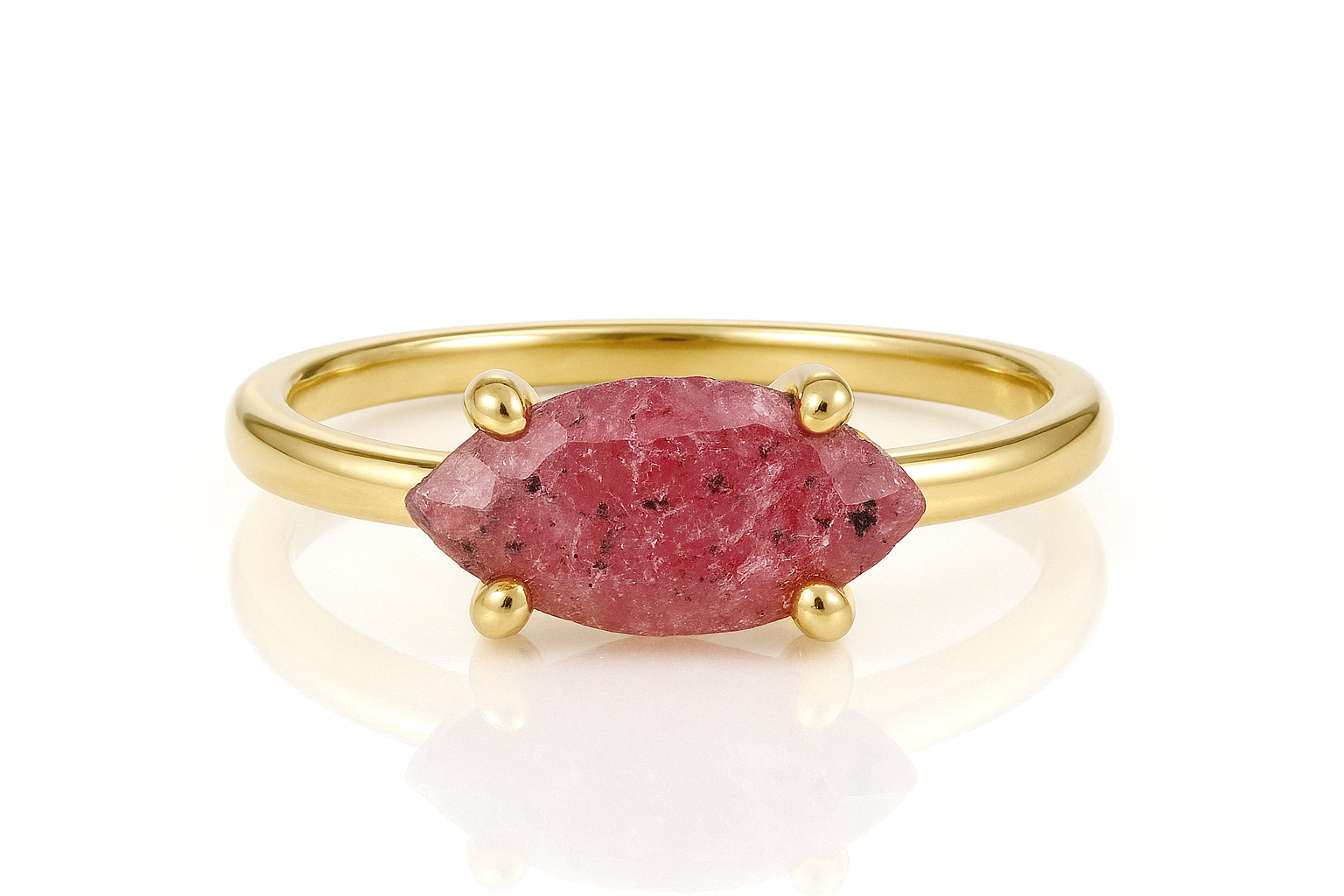 a gold ring with a pink stone on it