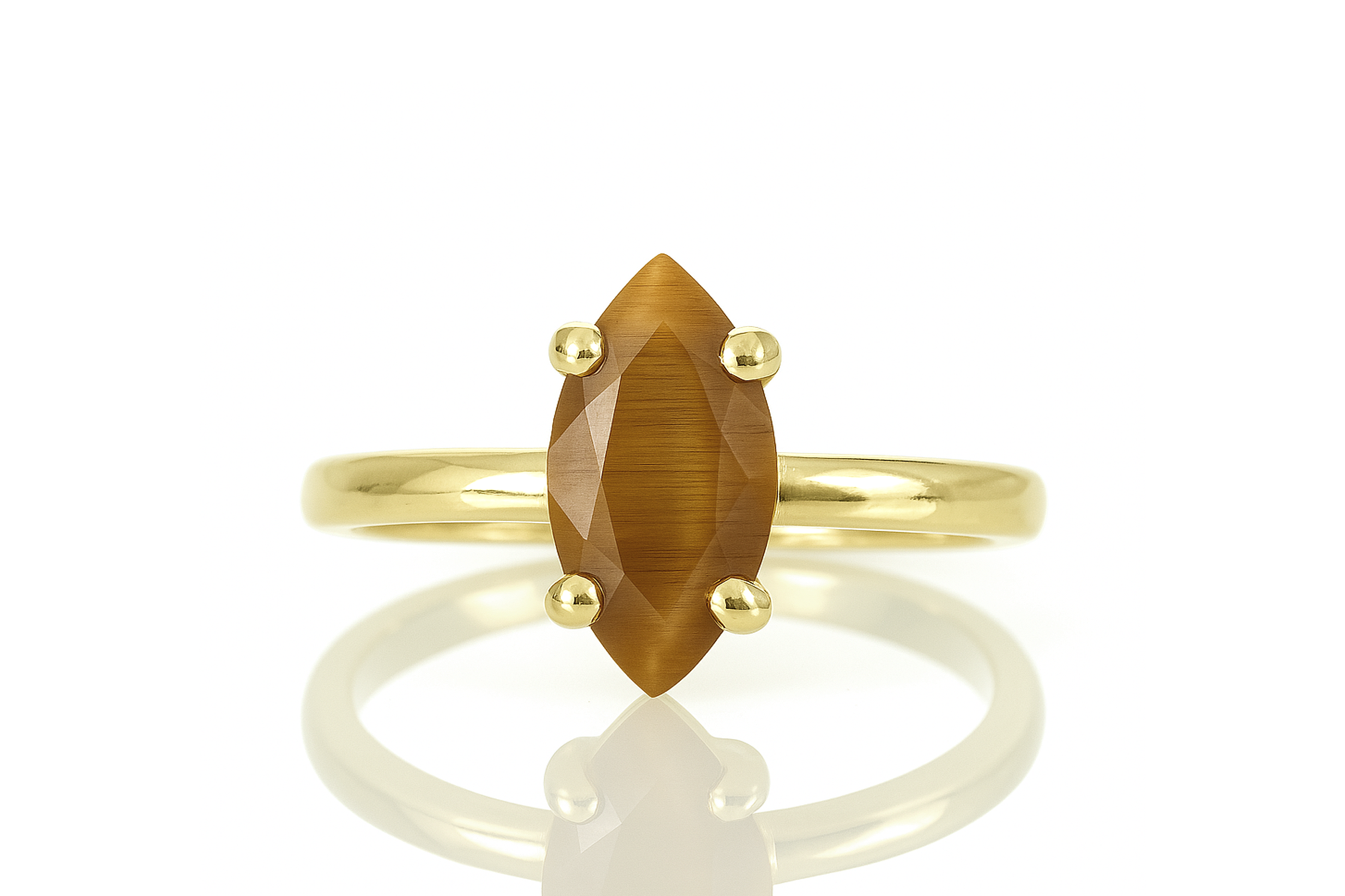 a yellow gold ring with a brown stone