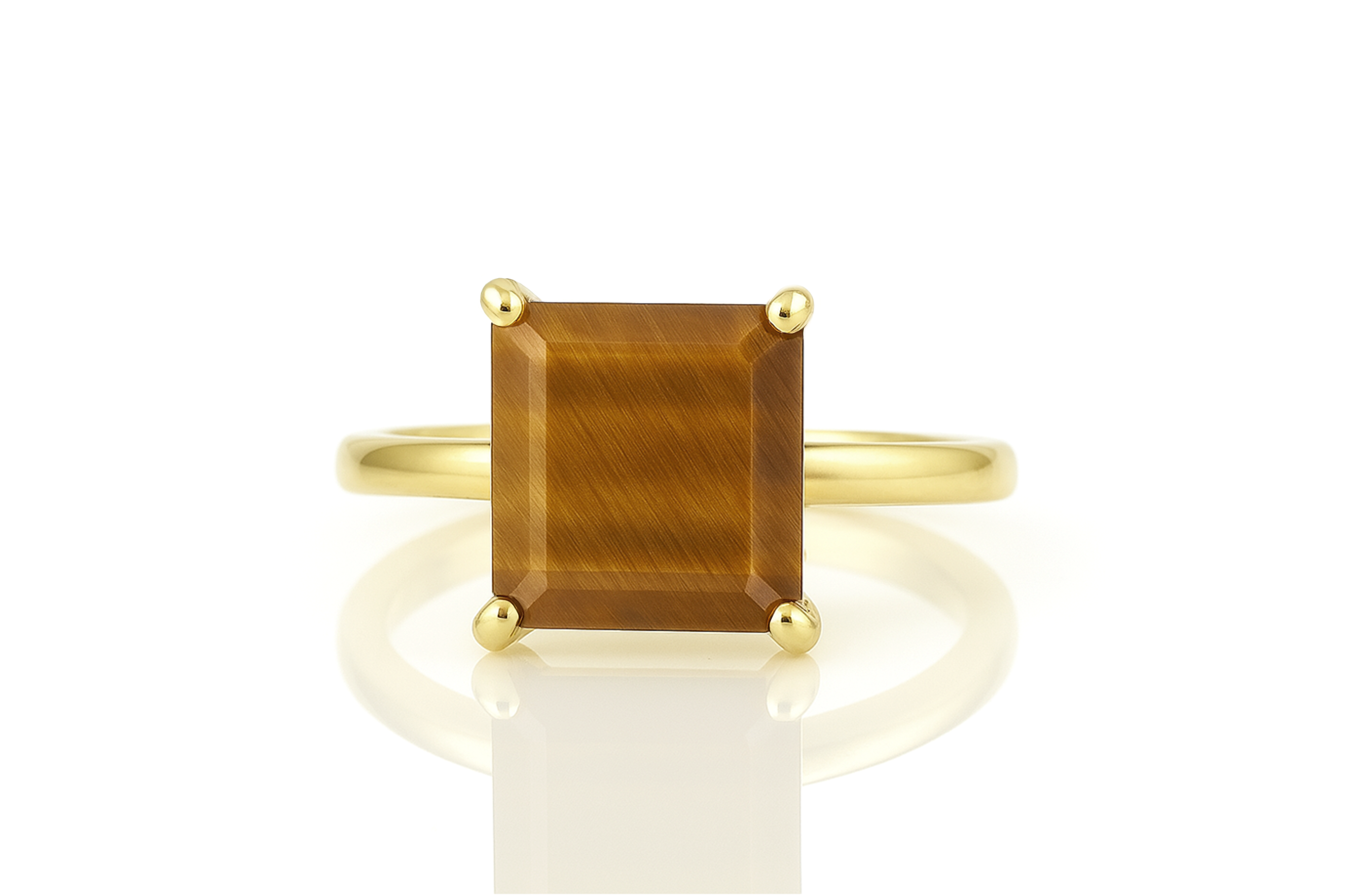 a yellow gold ring with a brown stone