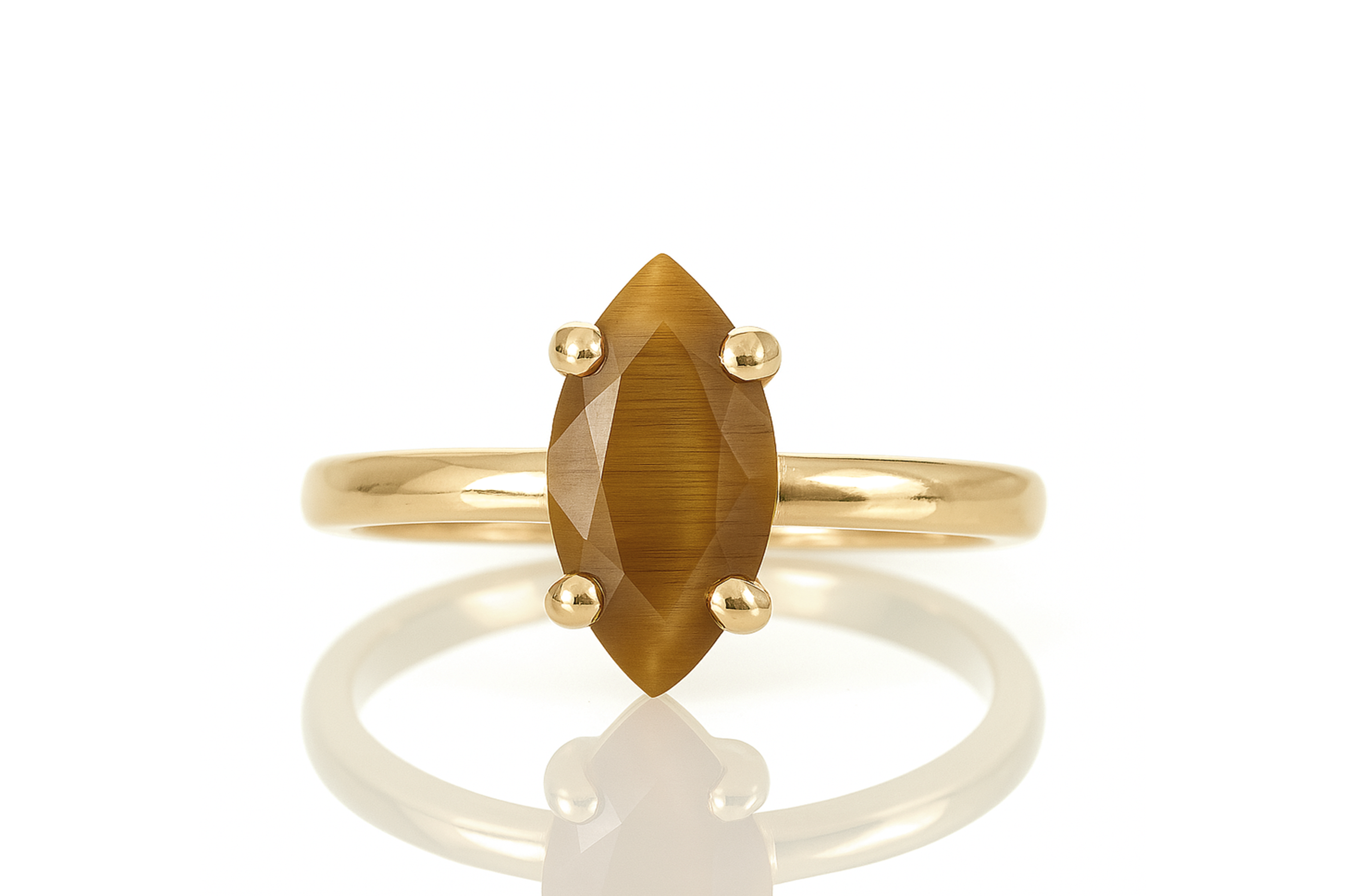 a yellow gold ring with a brown stone