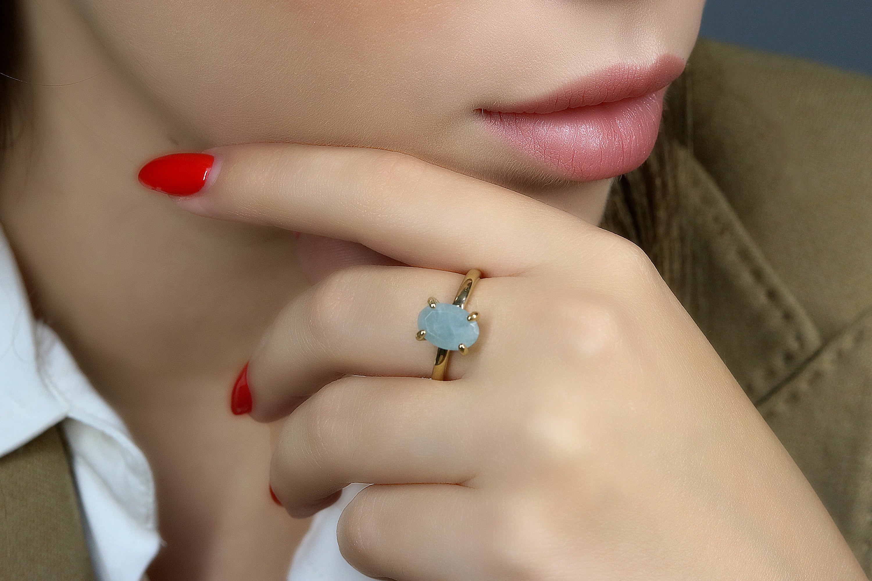 a close up of a person wearing a ring