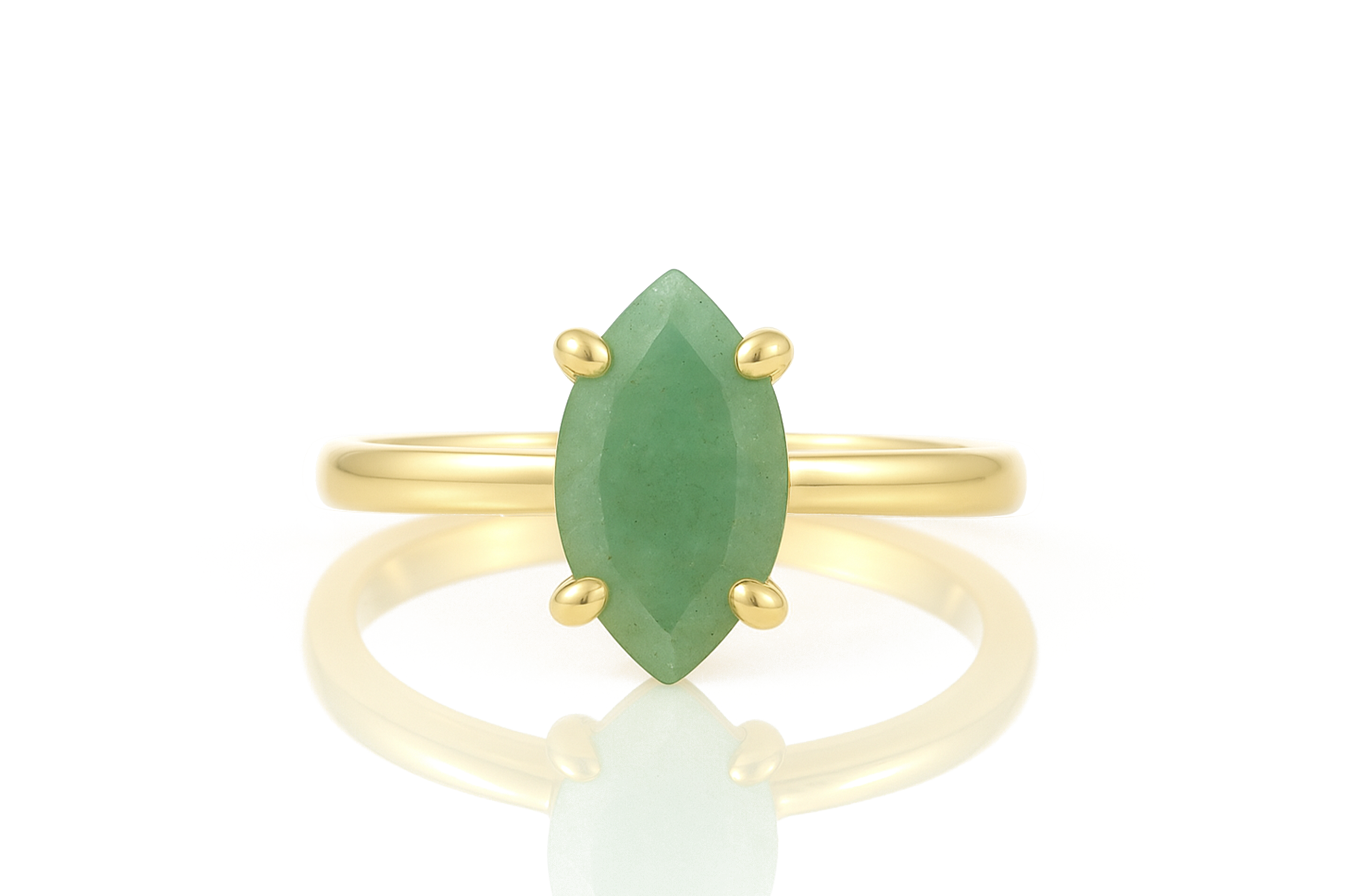 a gold ring with a green stone on it