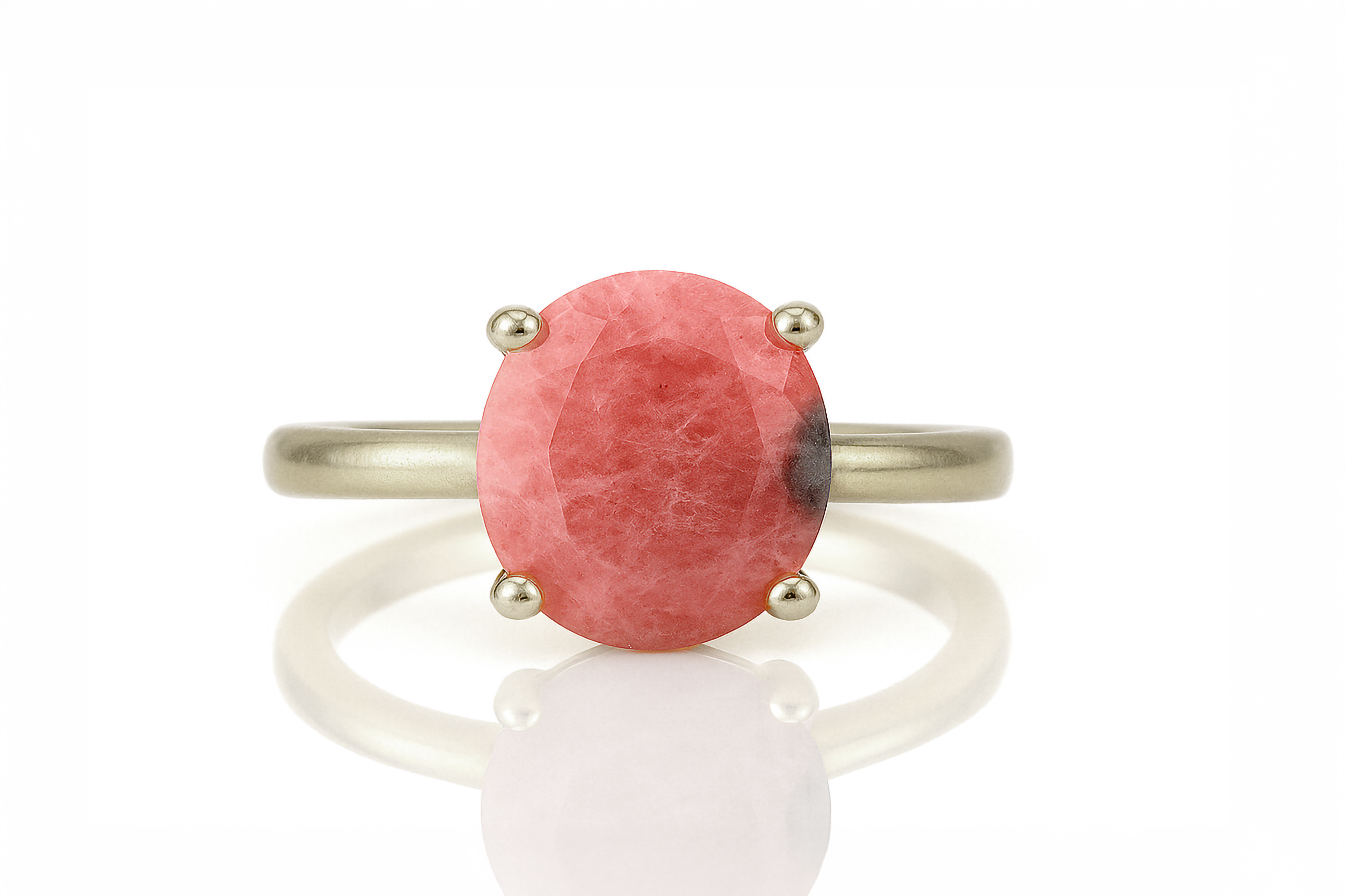 a ring with a large red stone on it