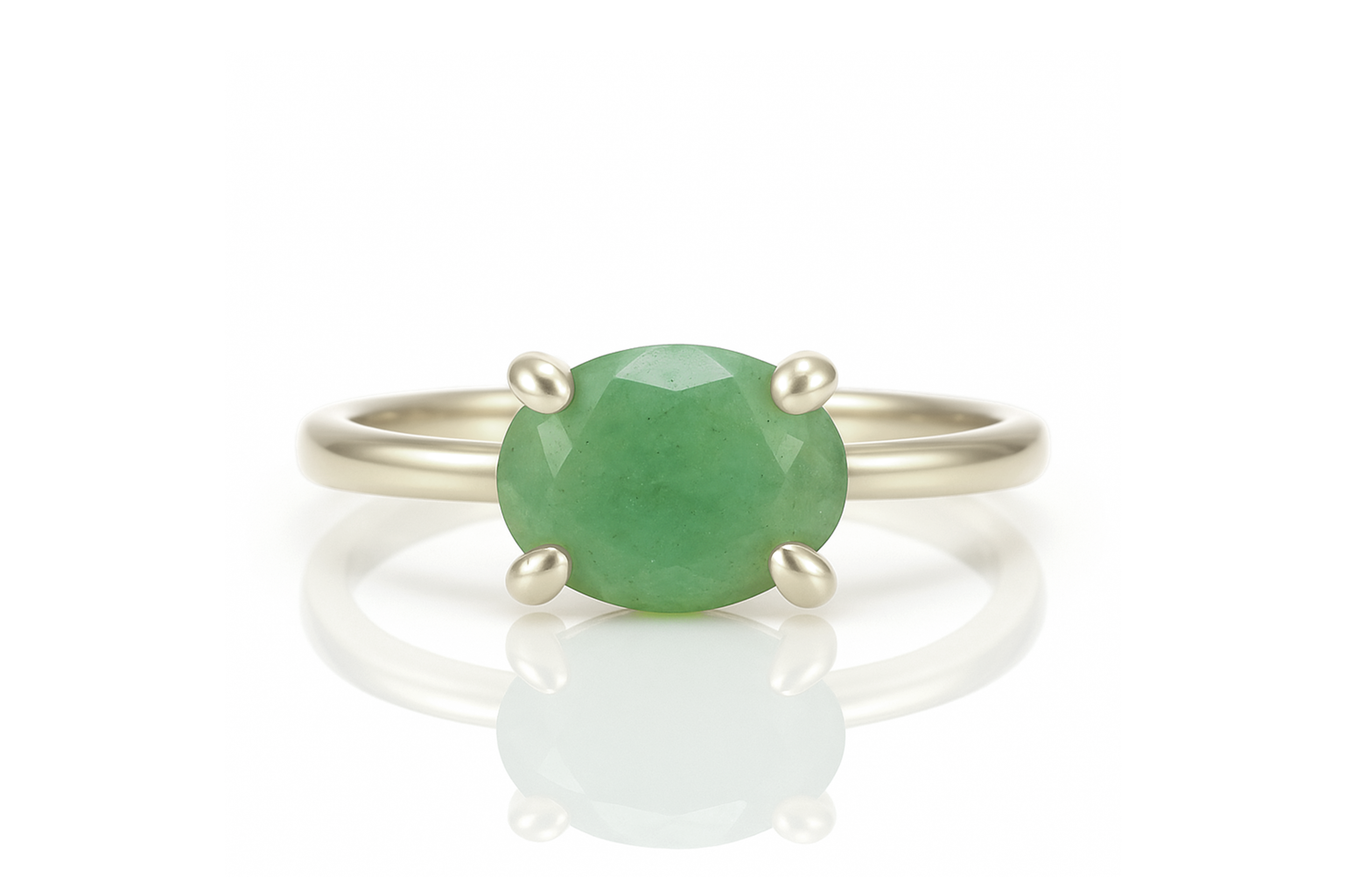 a ring with a green stone on it