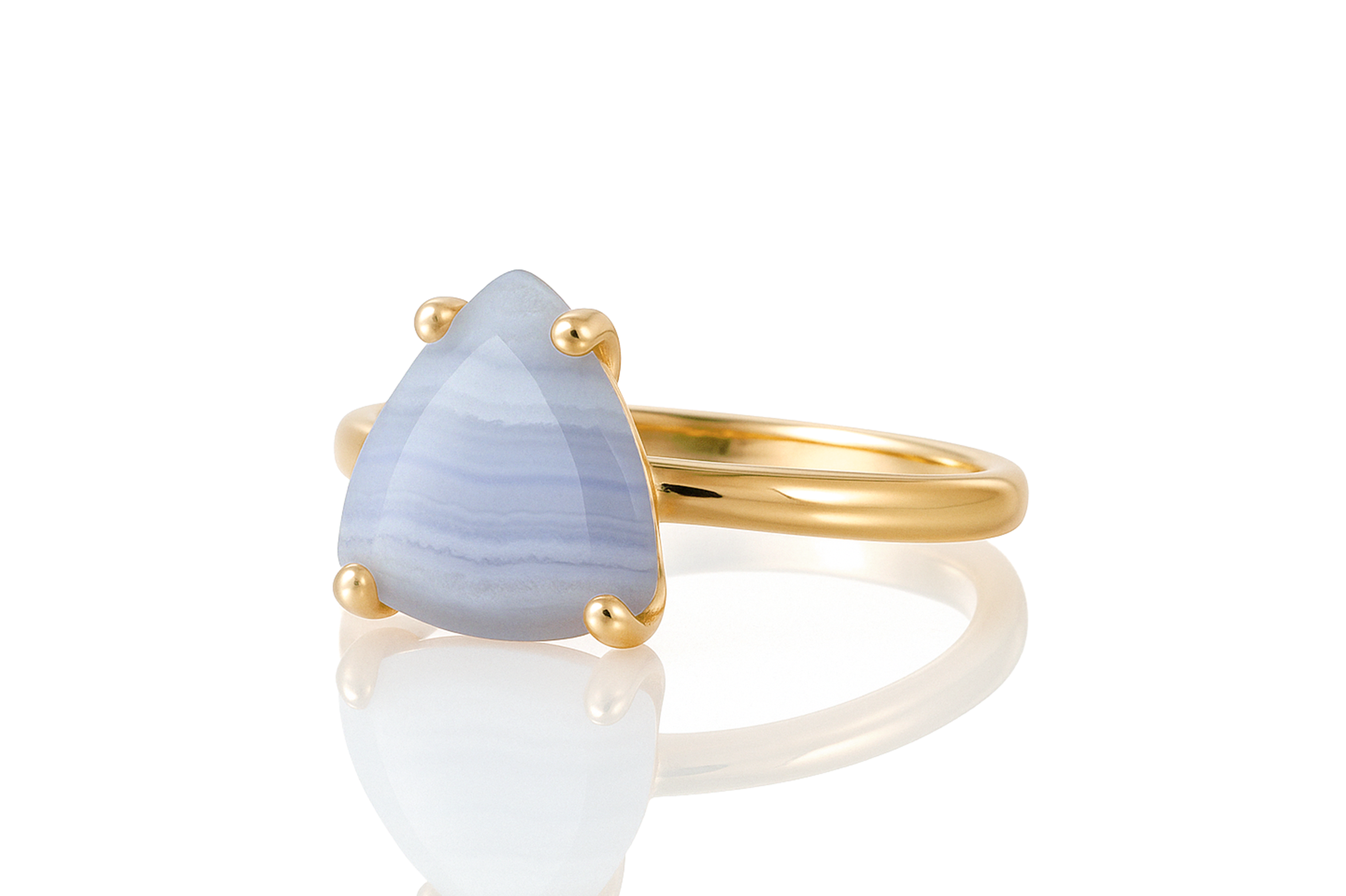 a gold ring with a blue stone on it