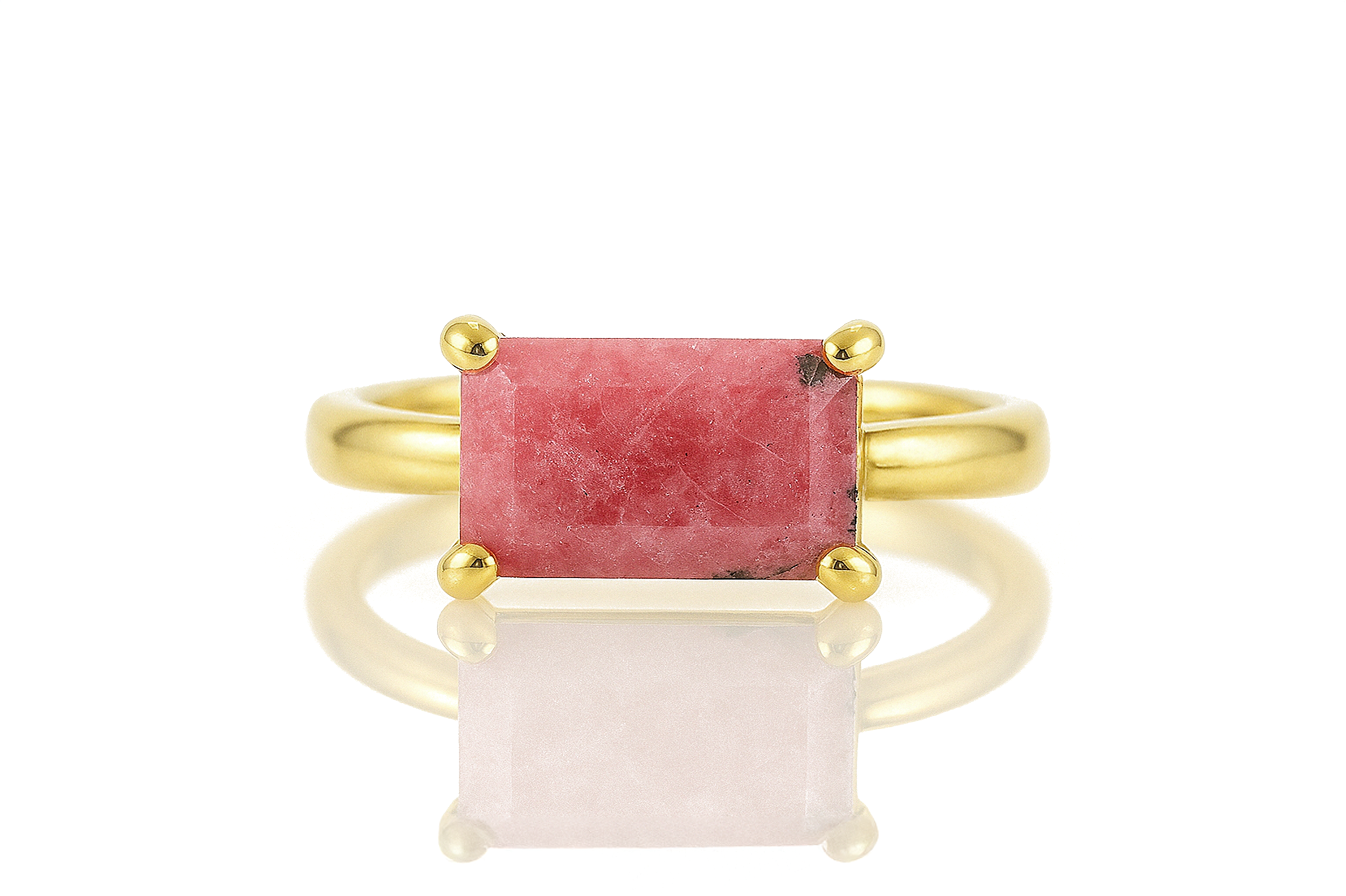 a gold ring with a red stone in it