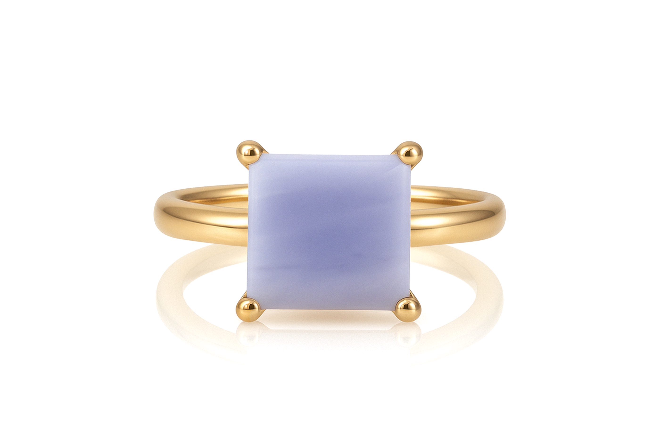 a yellow gold ring with a blue stone