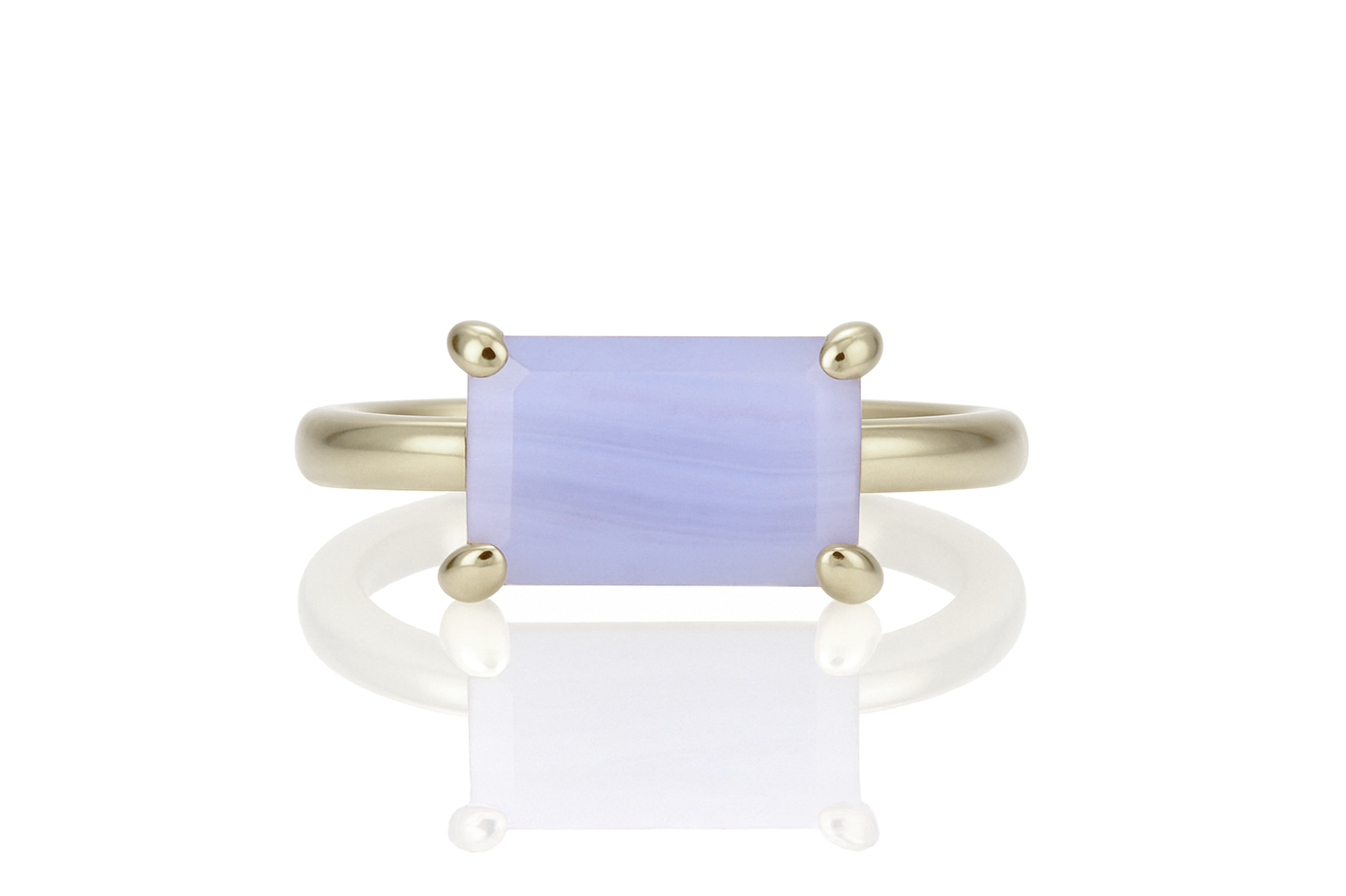 a yellow gold ring with a blue stone
