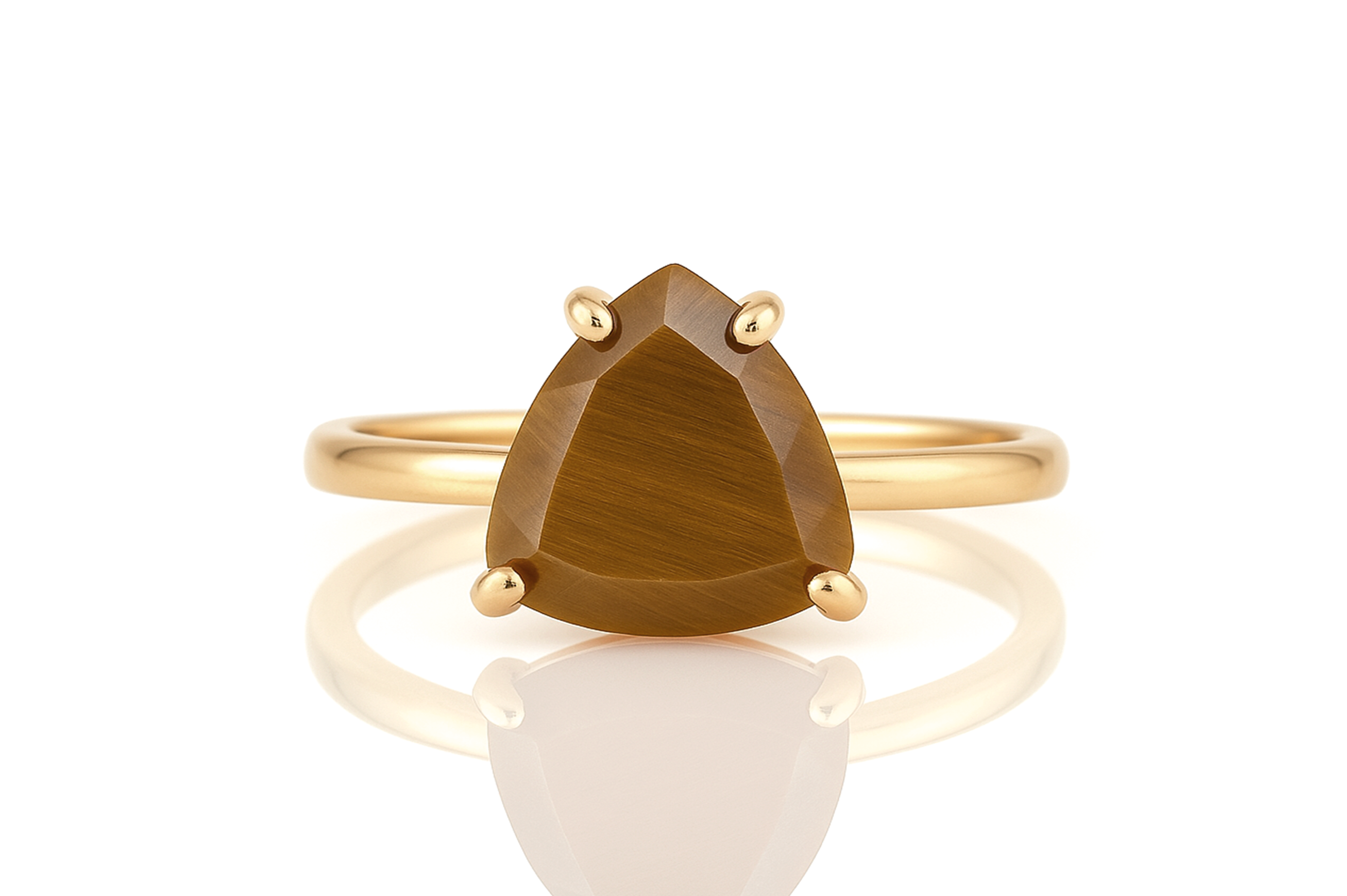 a gold ring with a pear shaped brown stone