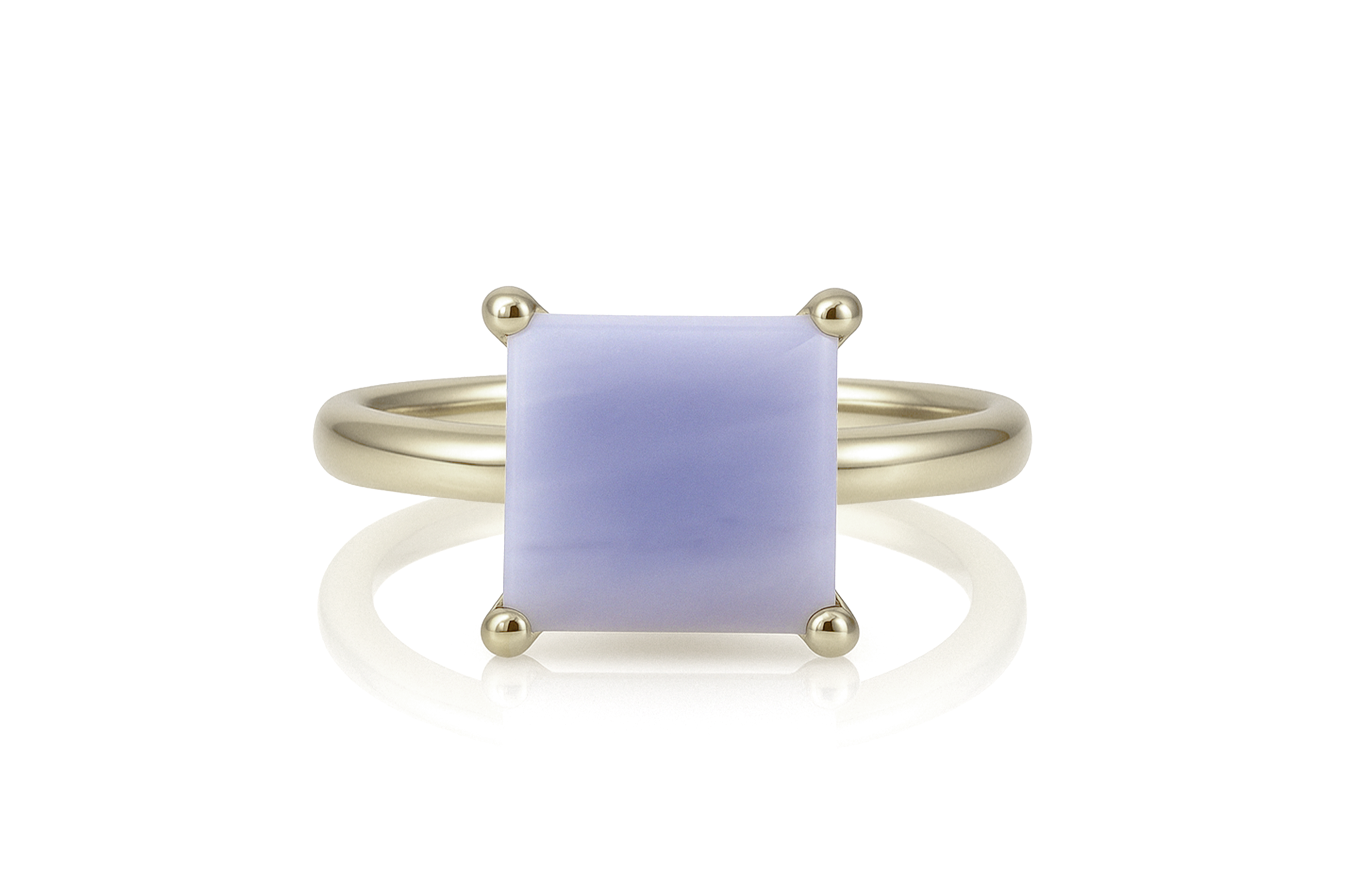 a yellow gold ring with a blue stone