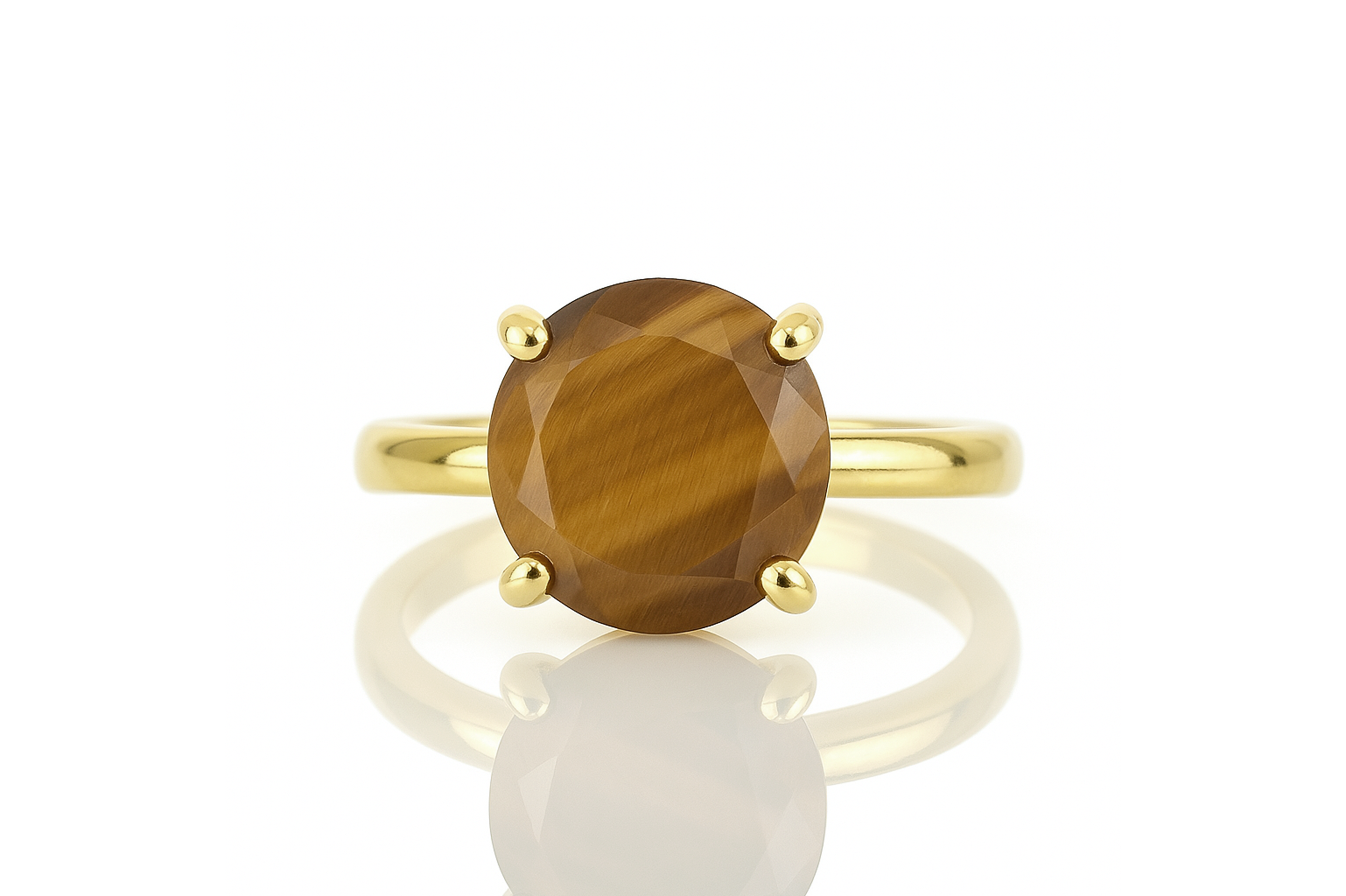 a yellow gold ring with a brown stone