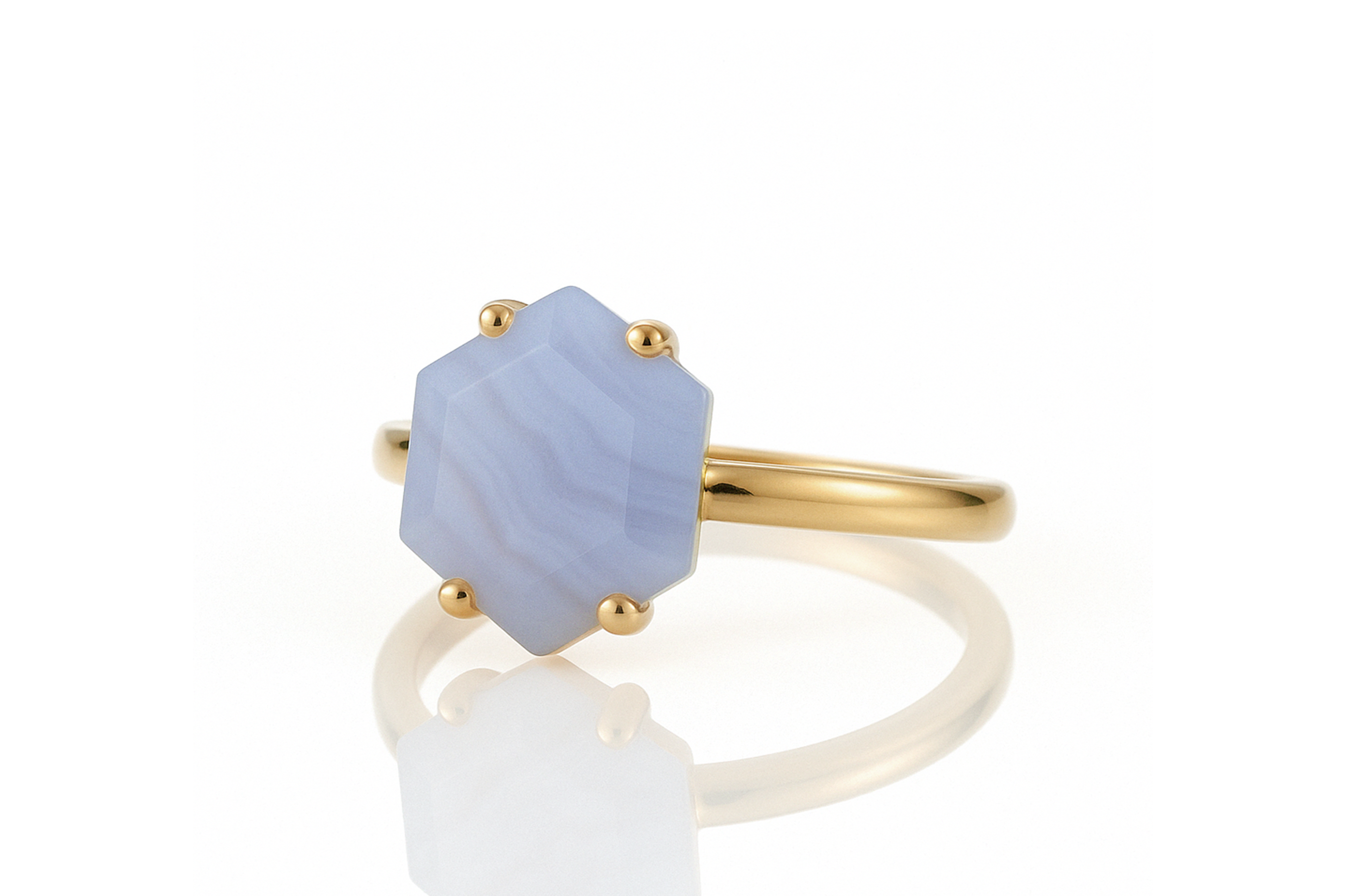 a gold ring with a blue stone on it
