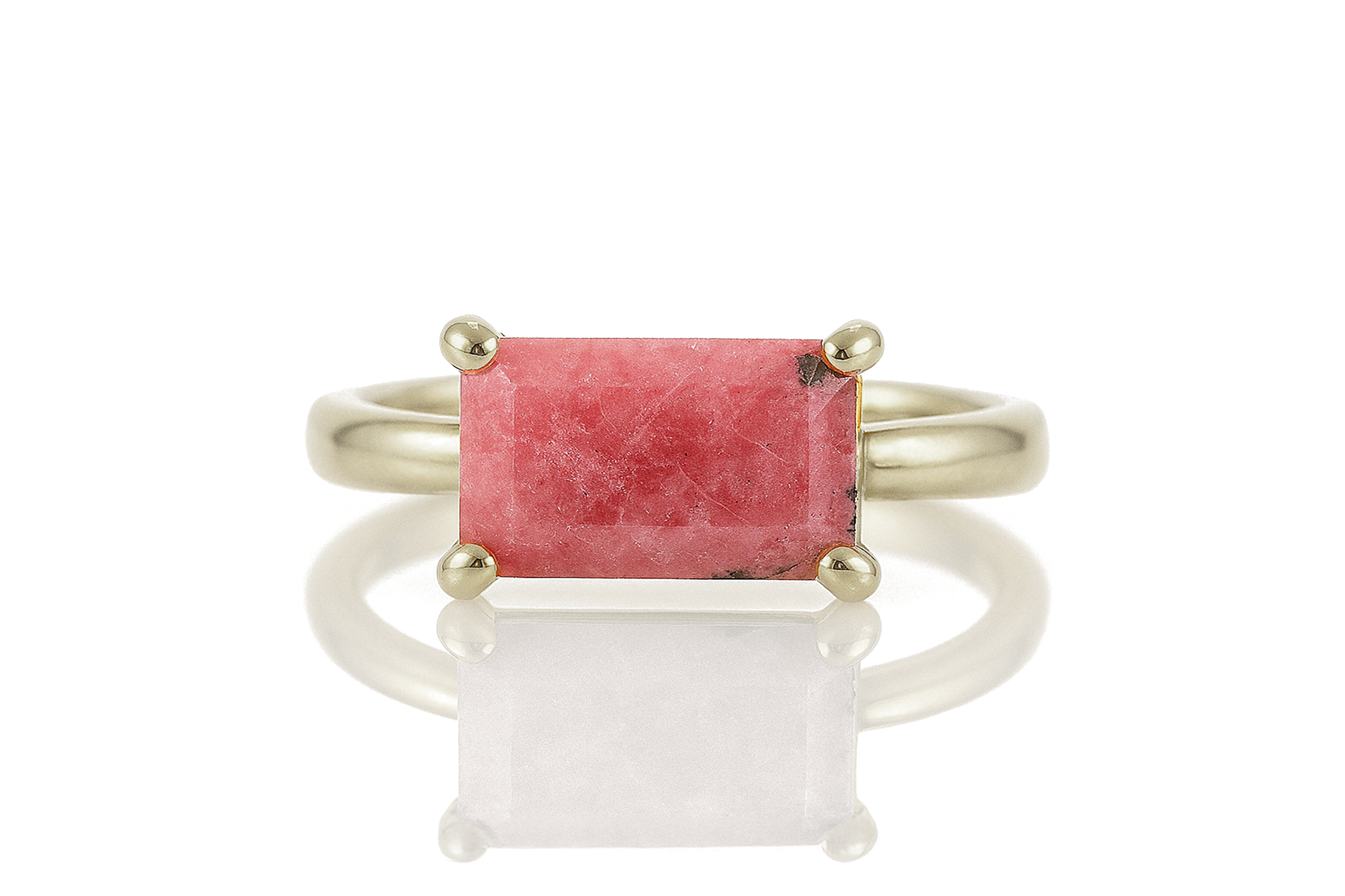 a ring with a red stone in it