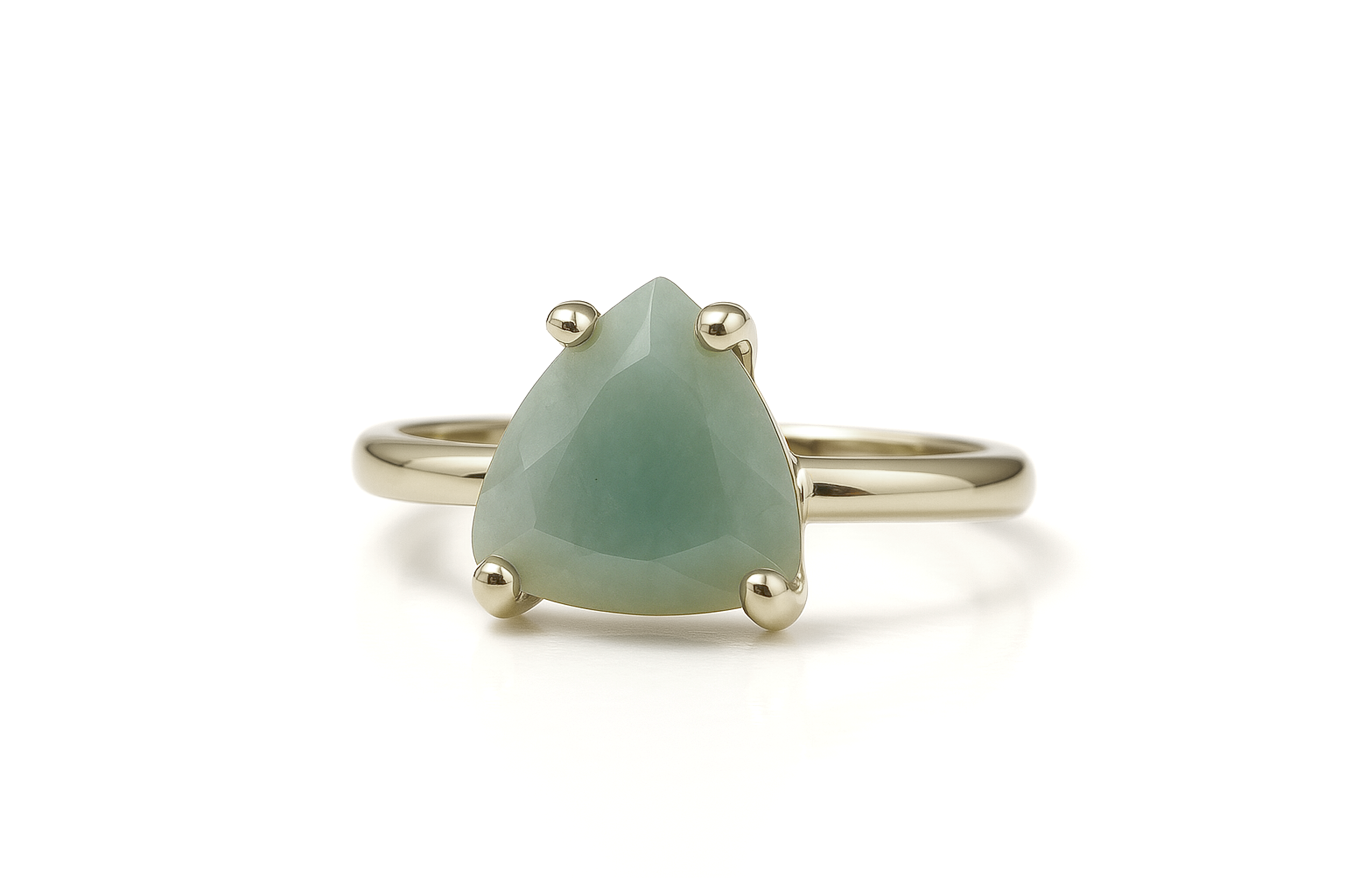 a gold ring with a green stone on it