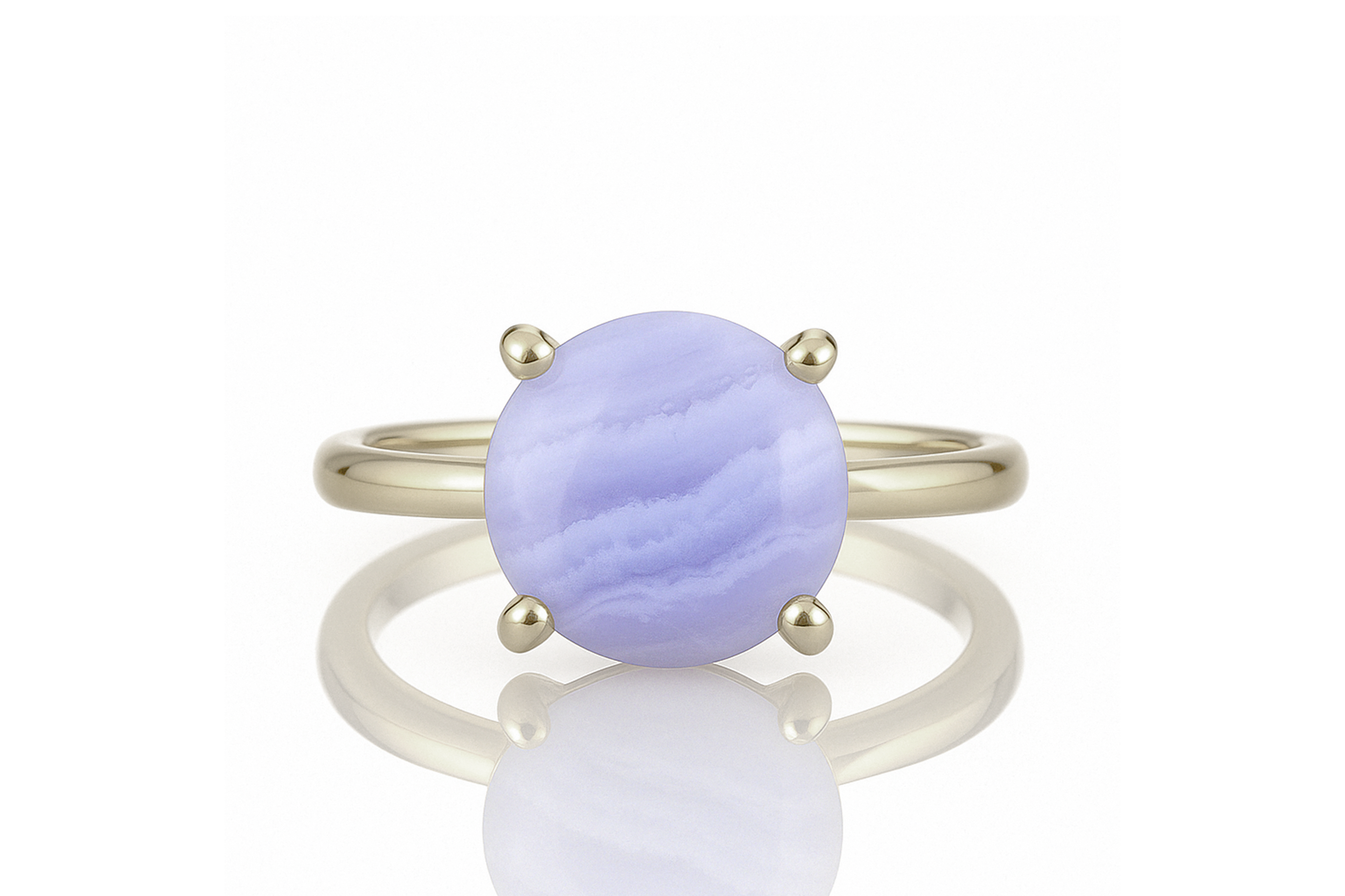 a yellow gold ring with a purple stone