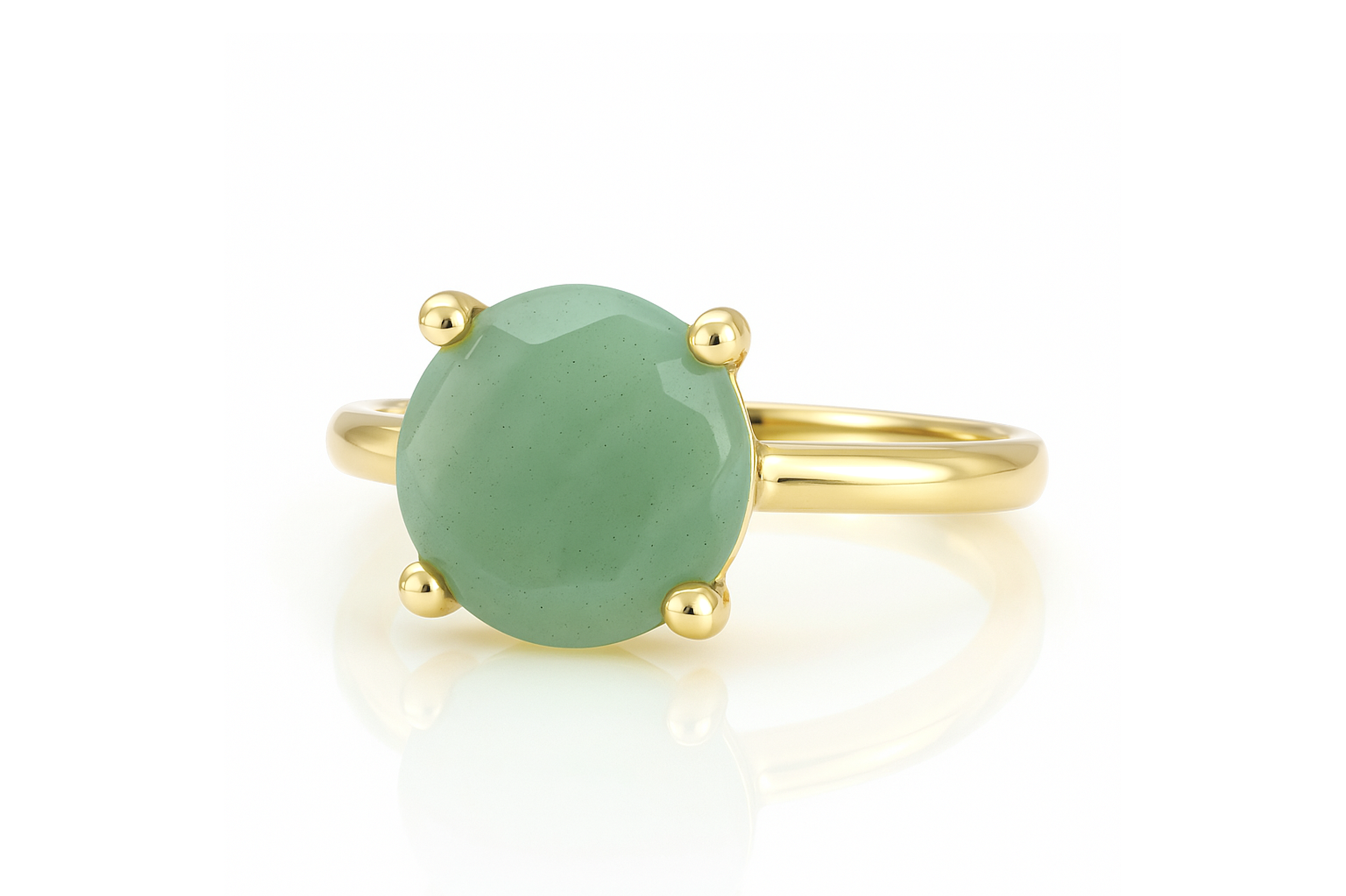 a gold ring with a green stone on it