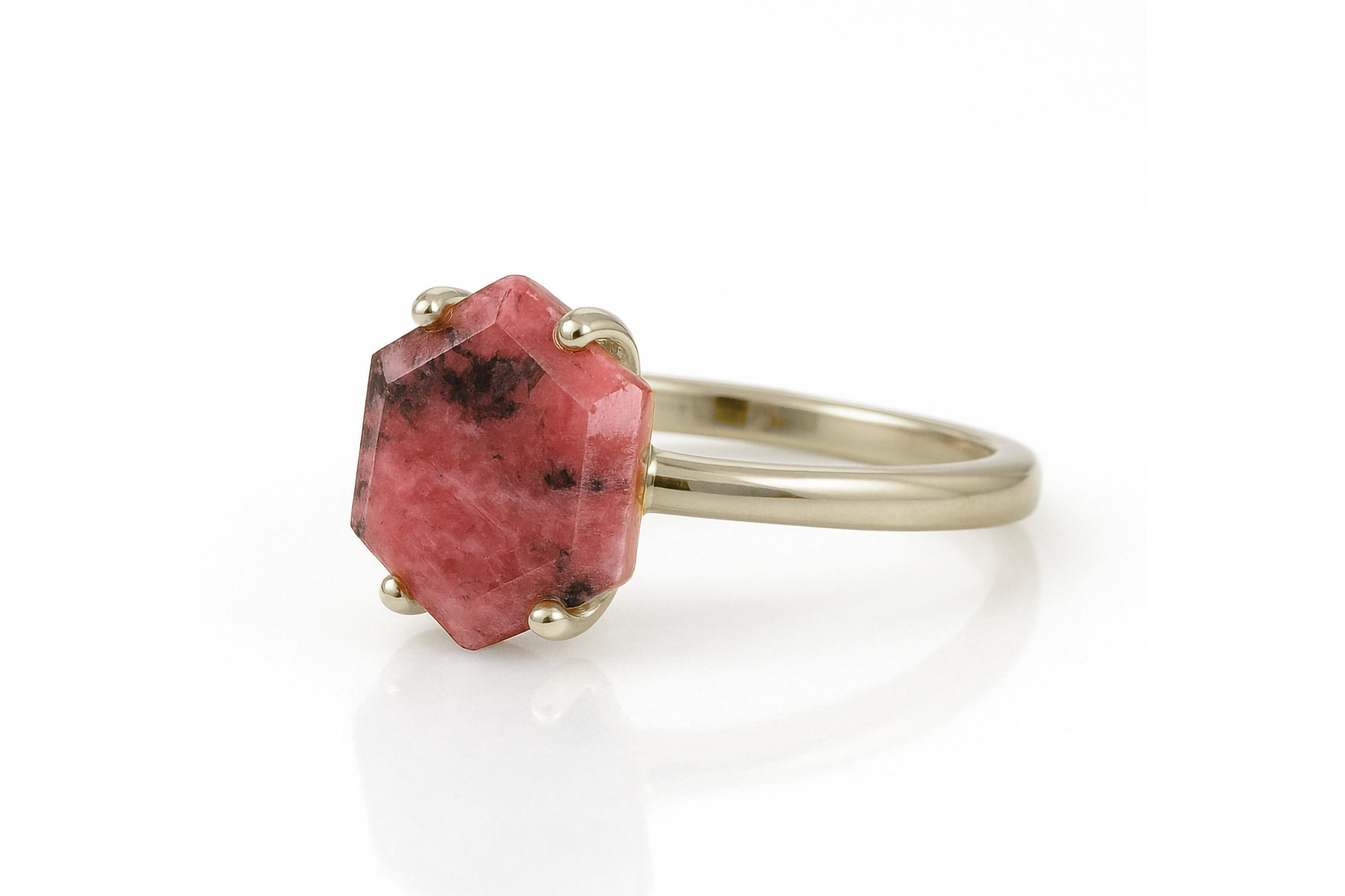 a ring with a red stone on it