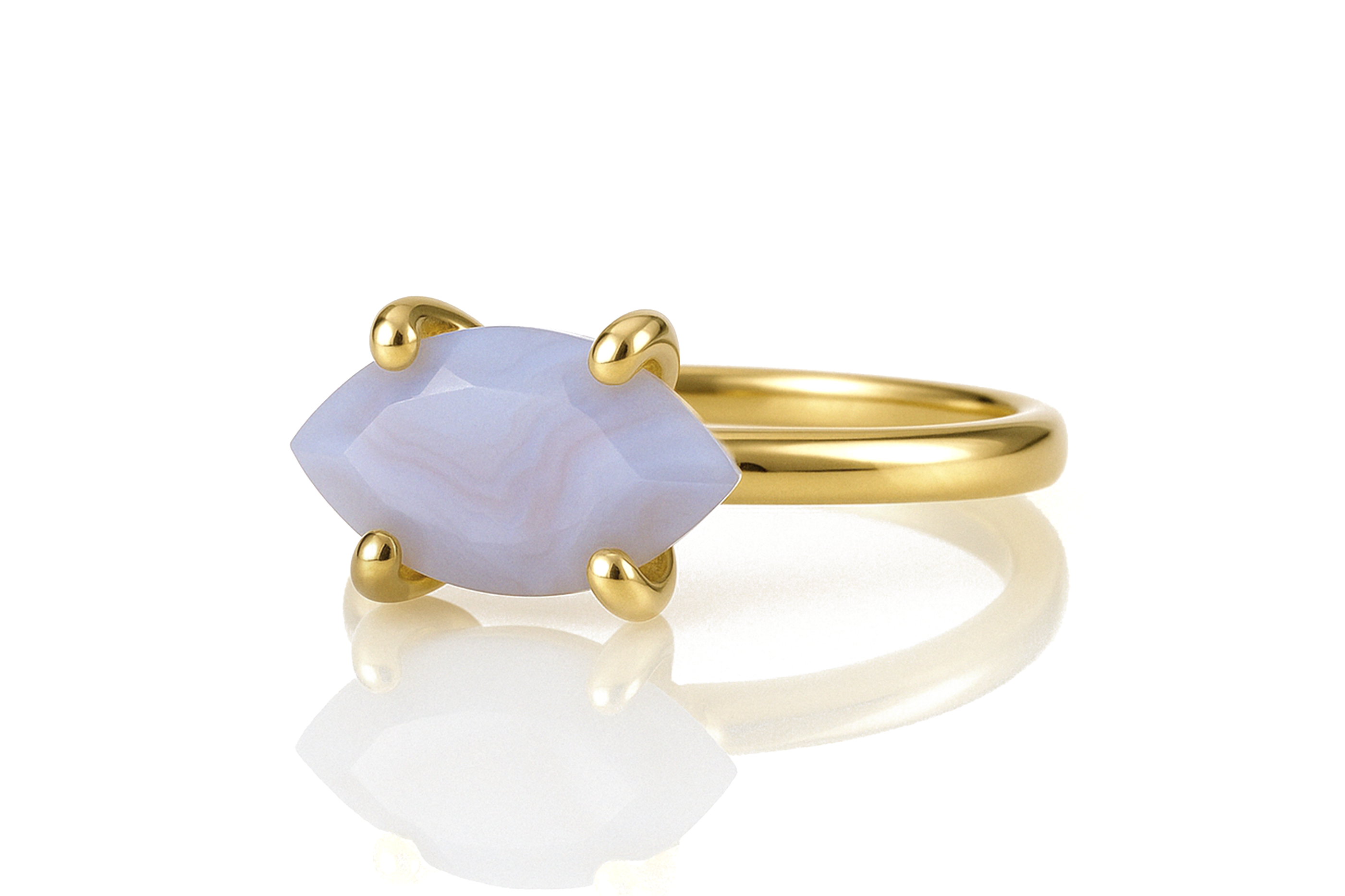 a gold ring with a blue stone on it