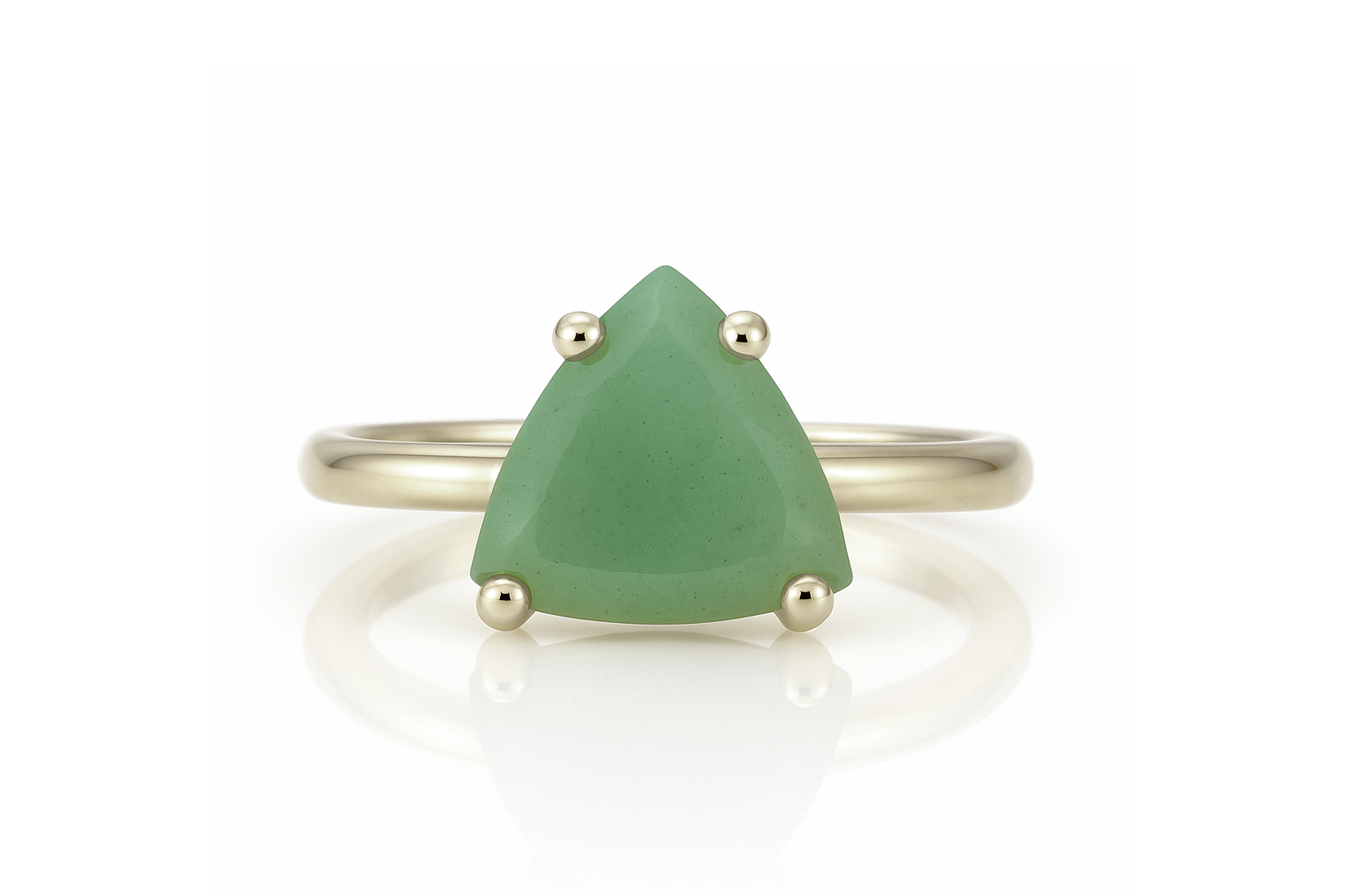 a close up of a ring with a green stone