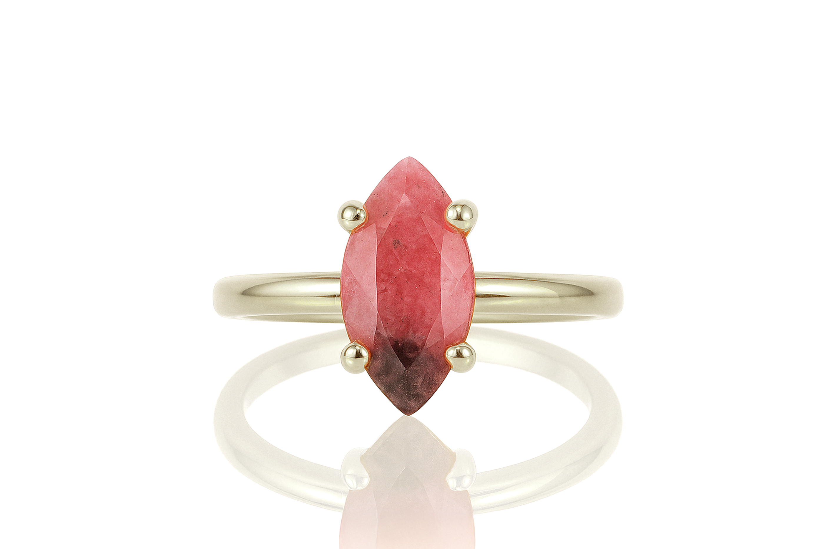 a close up of a ring with a red stone