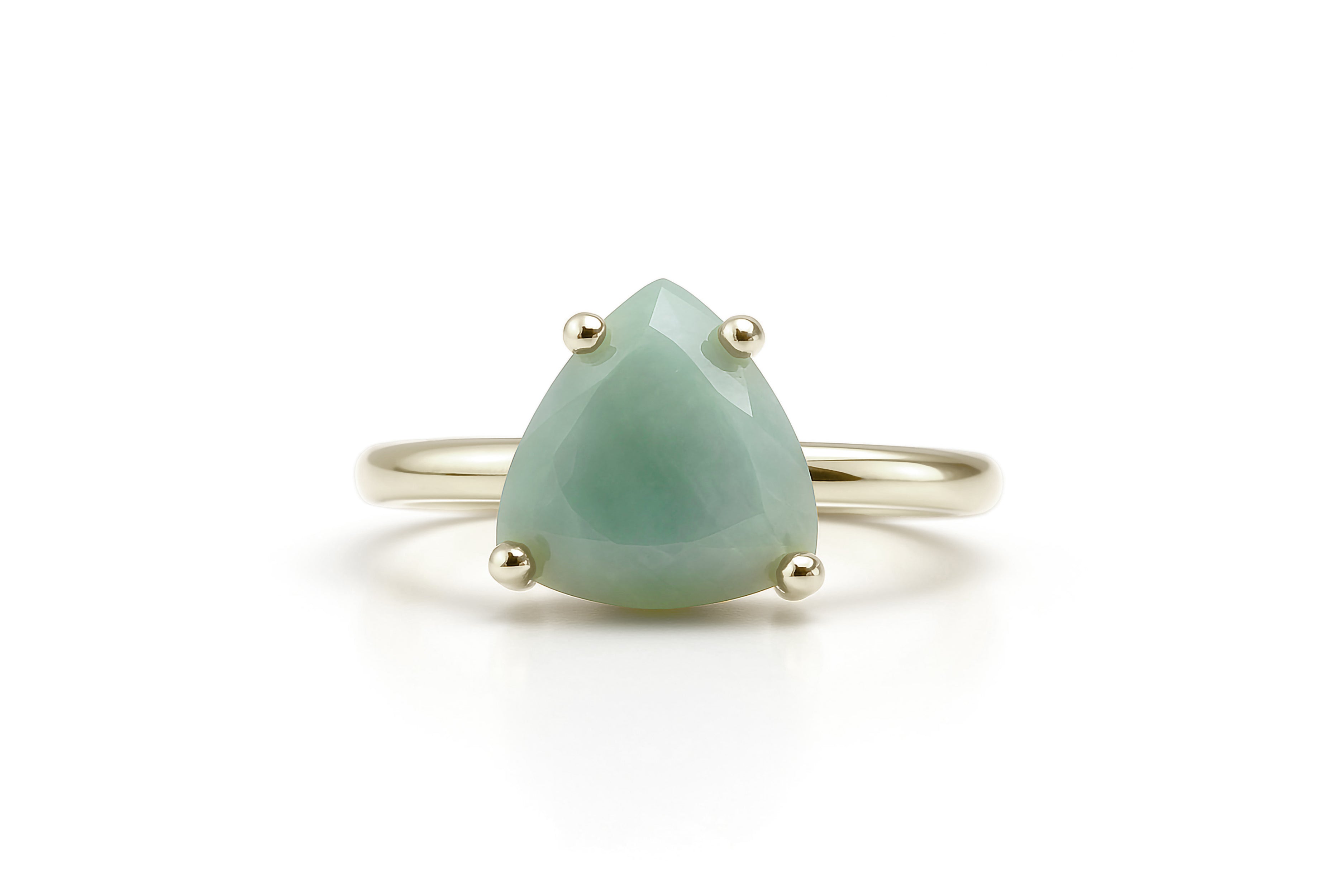 a ring with a pear shaped green stone