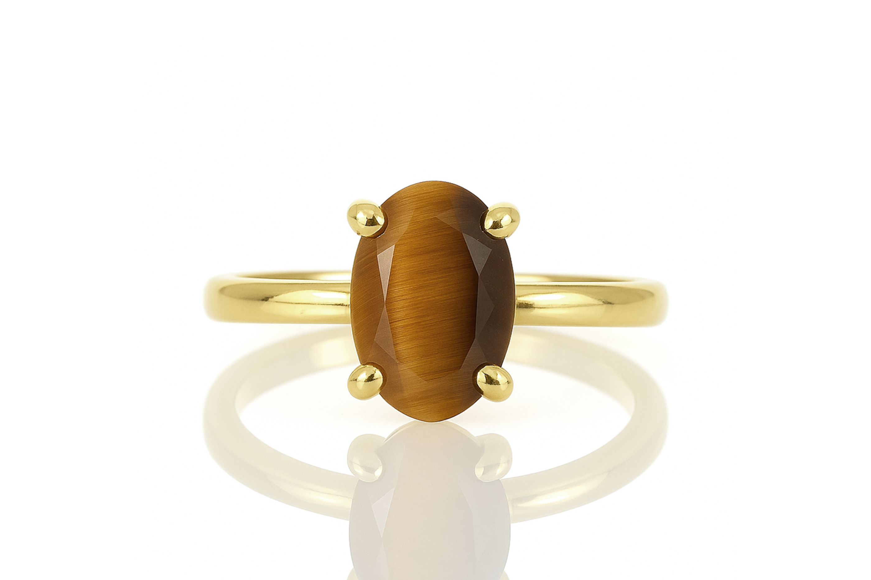 a yellow gold ring with a brown stone