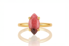 a gold ring with a red stone on it