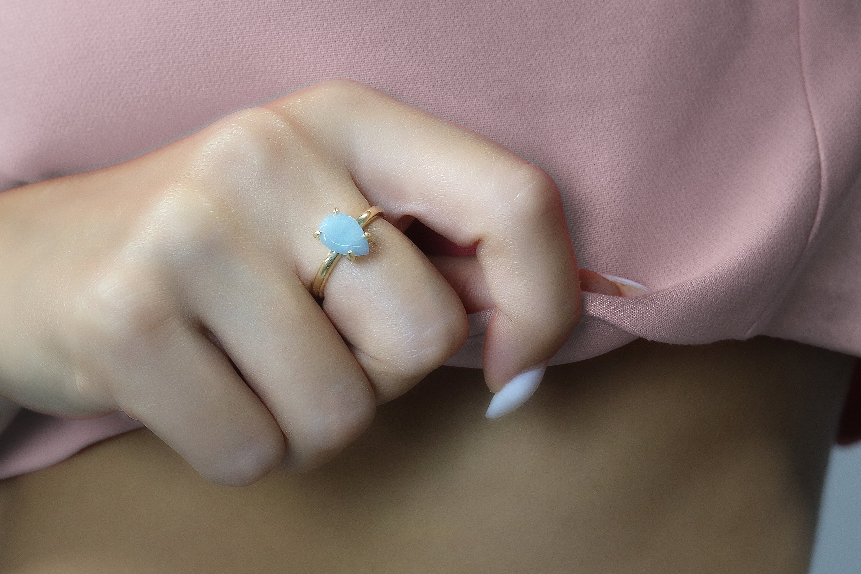 a close up of a person wearing a ring