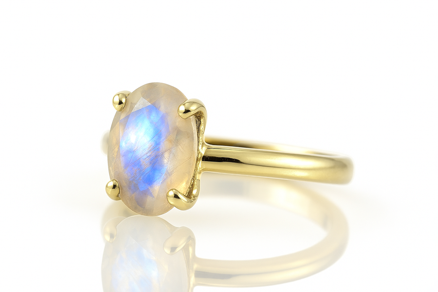 a yellow gold ring with a rainbow stone