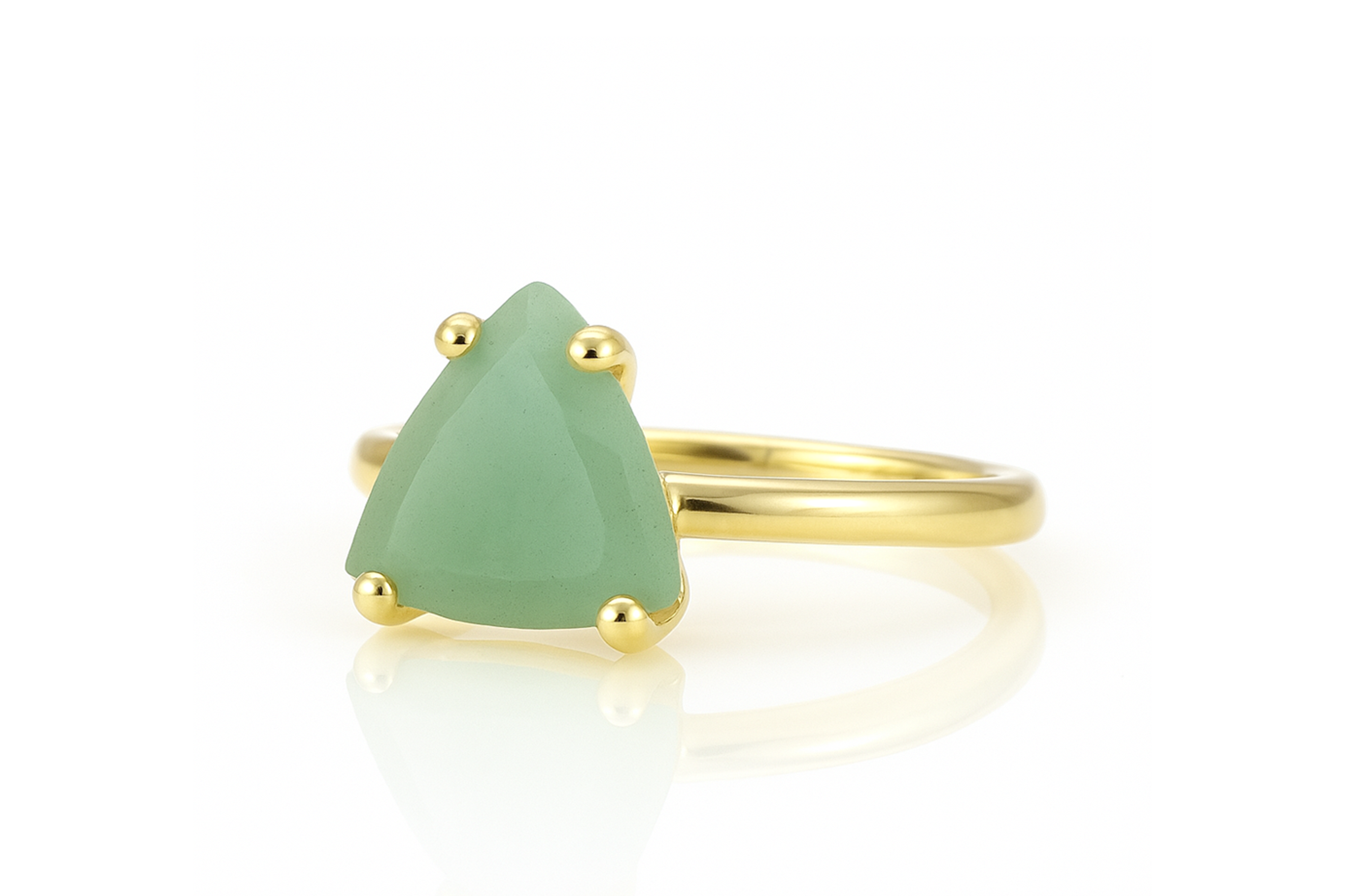 a gold ring with a green stone on it