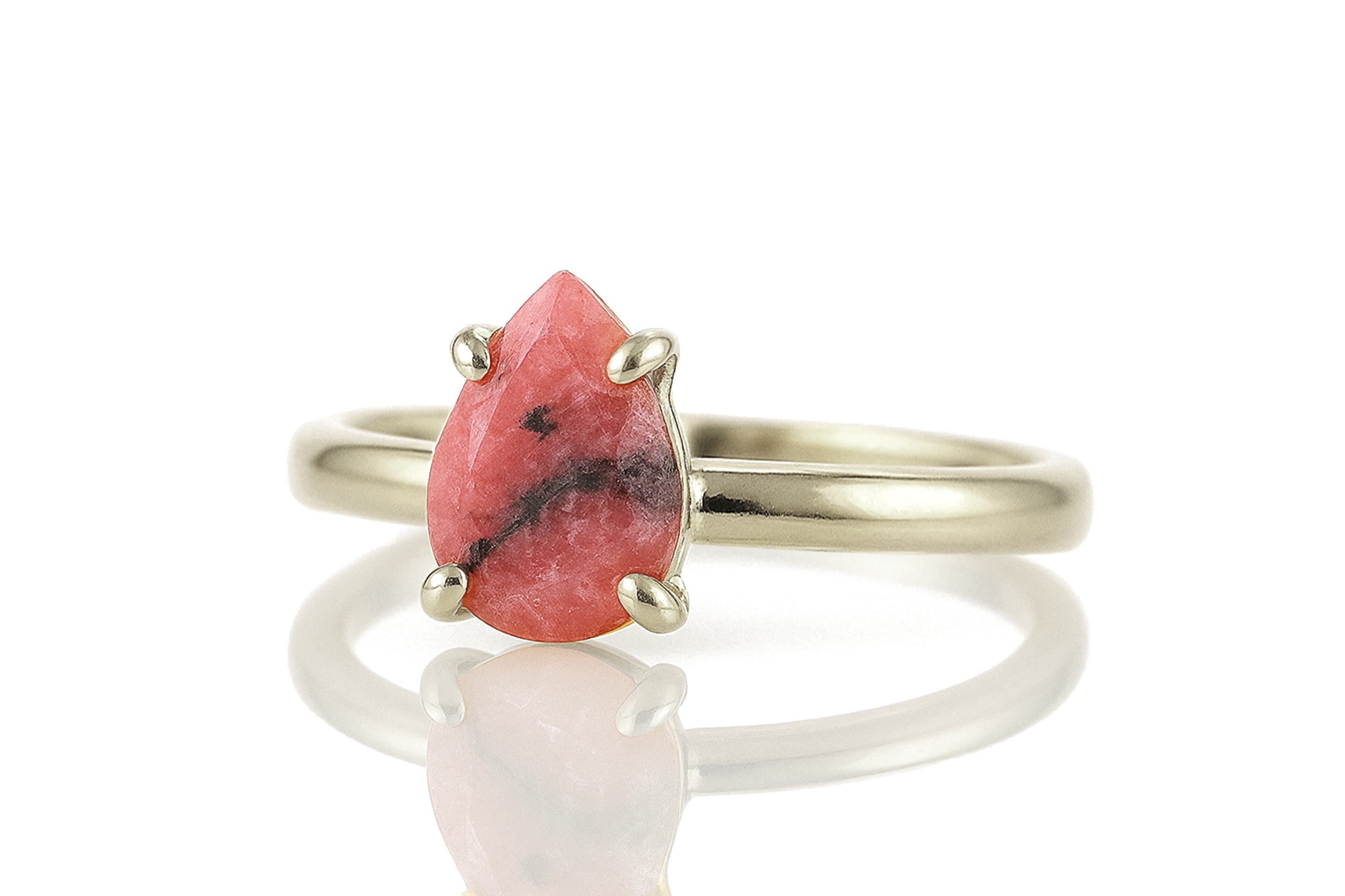 a ring with a red stone on it