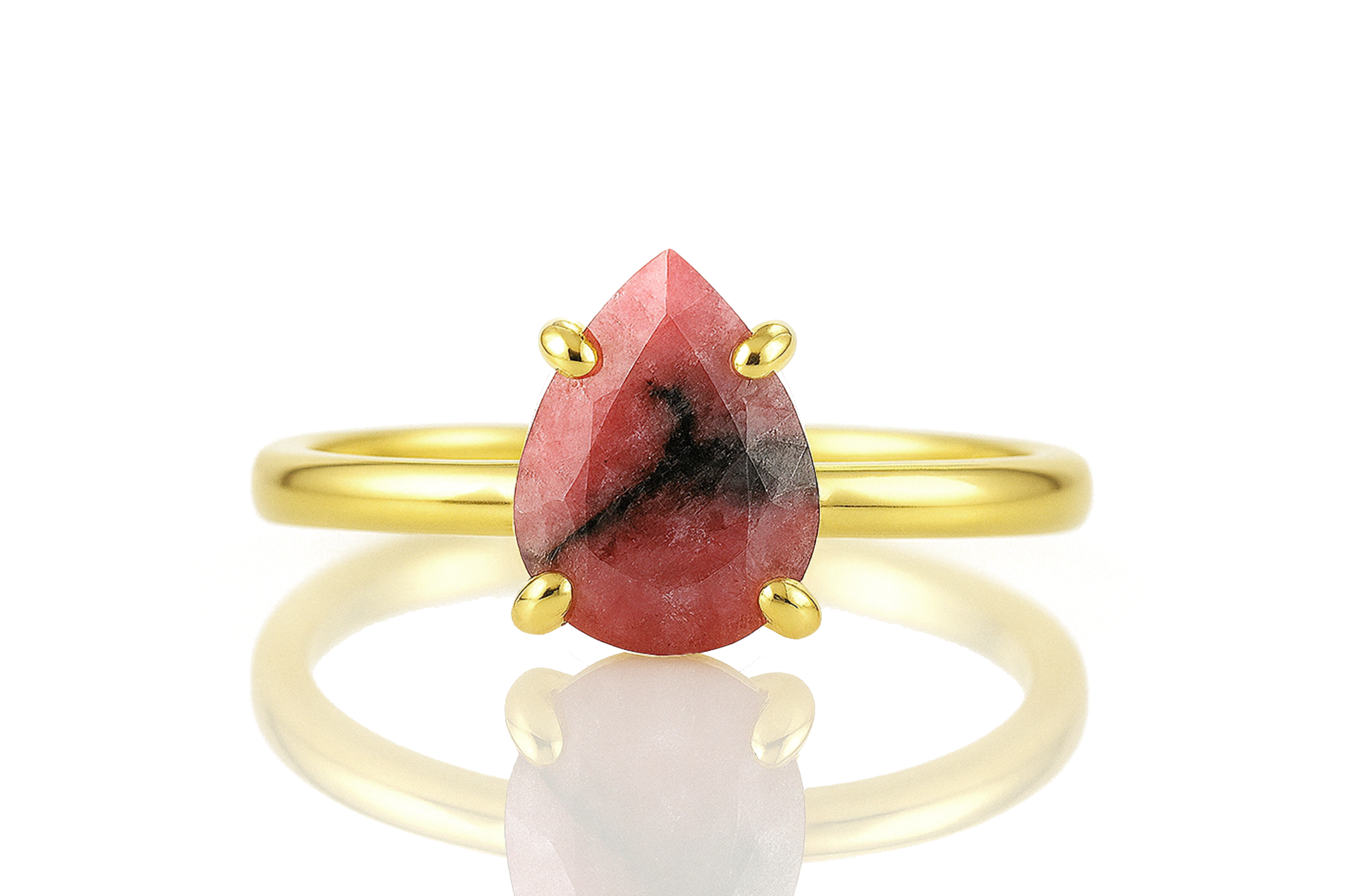 a yellow gold ring with a red stone