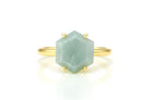 a gold ring with a green stone on it