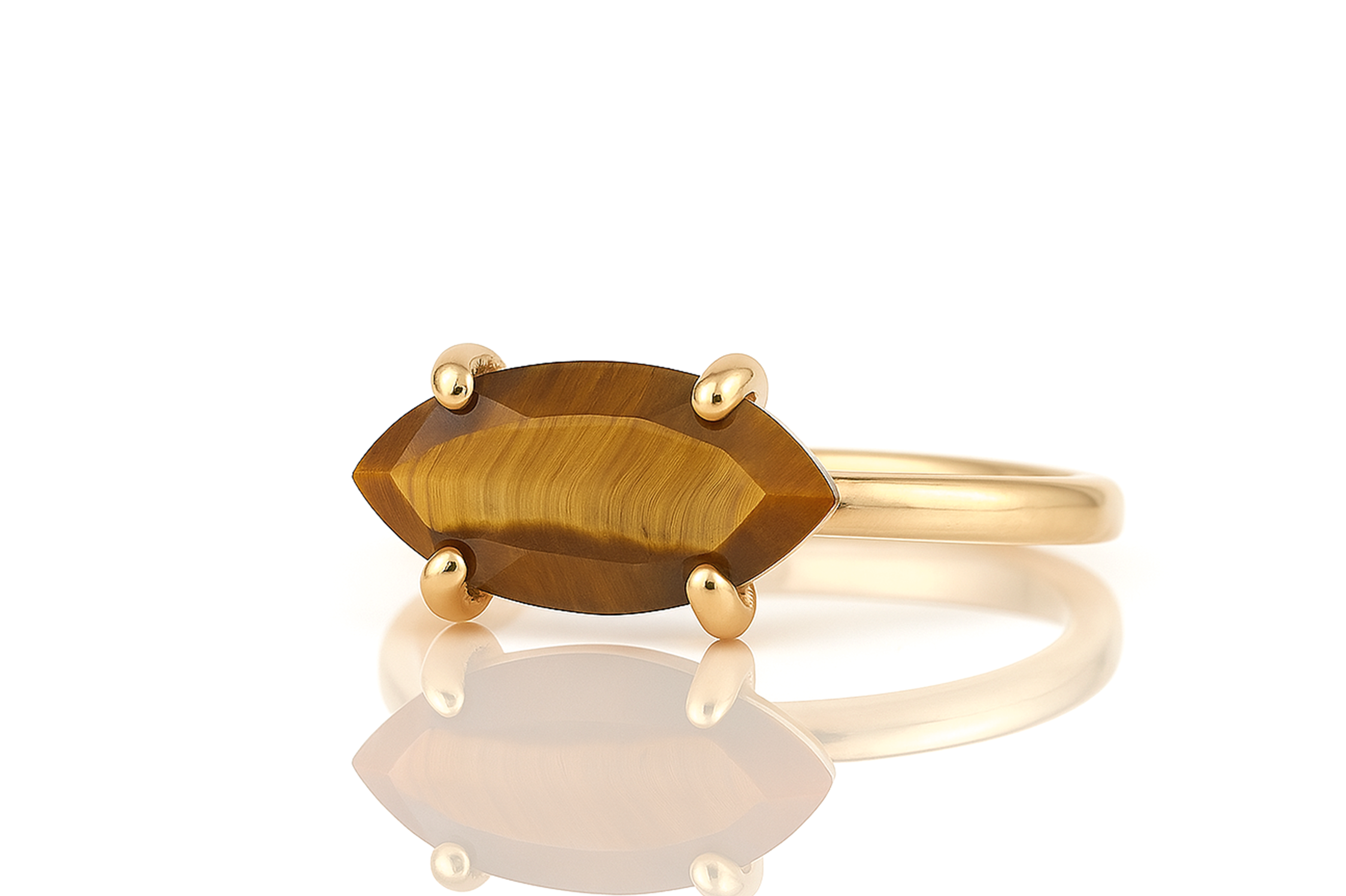 a yellow gold ring with a tiger's eye stone