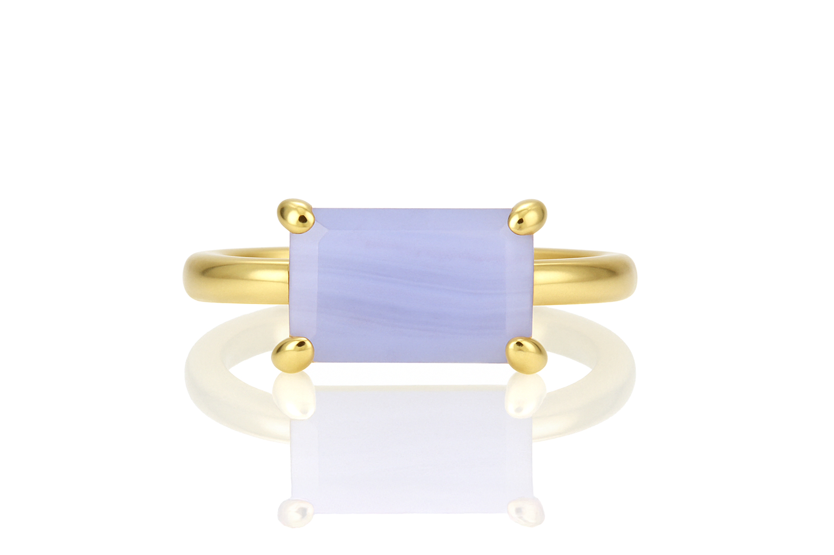 a yellow gold ring with a blue stone