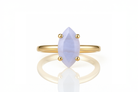 a yellow gold ring with a white stone