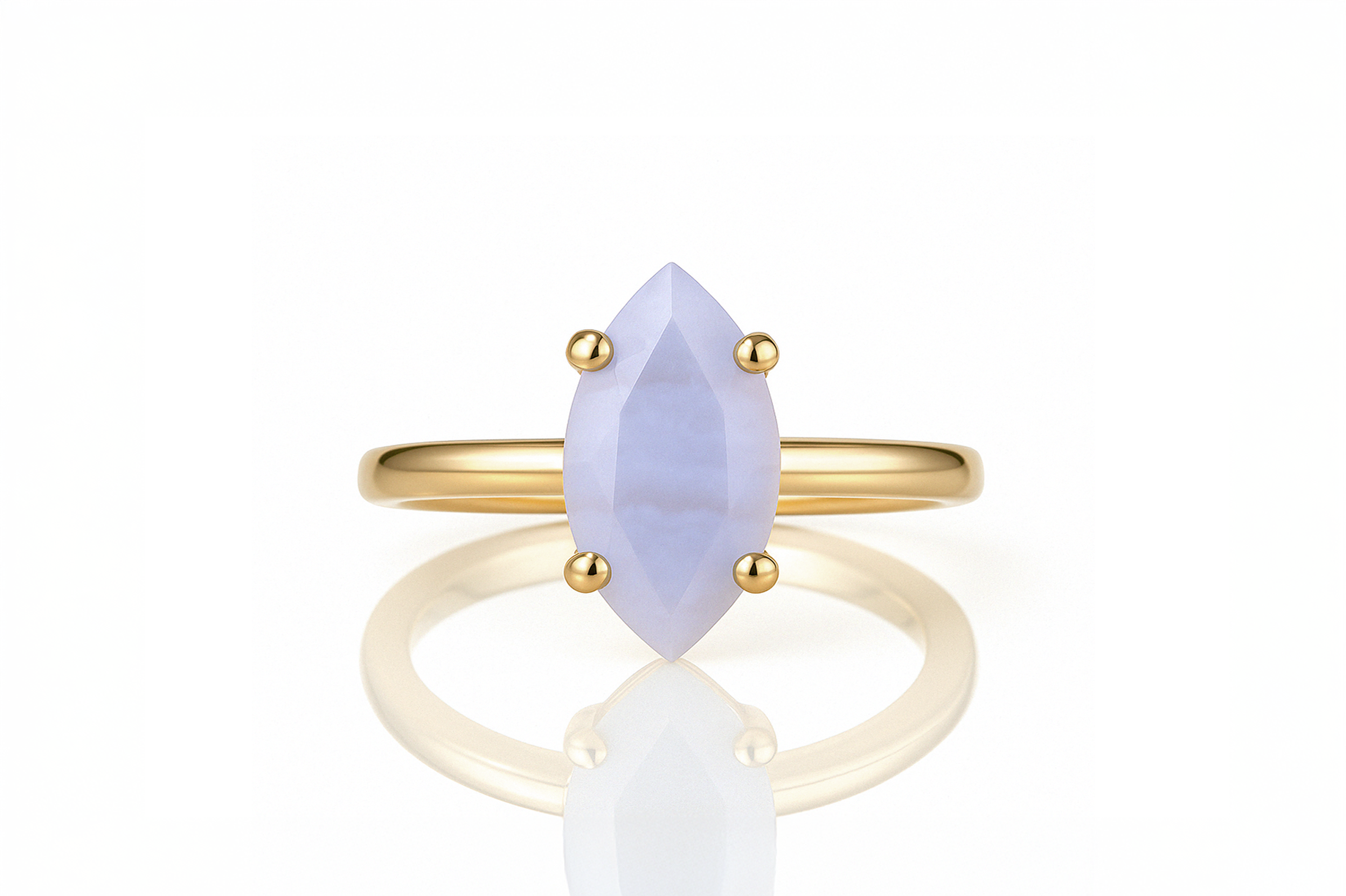 a yellow gold ring with a white stone
