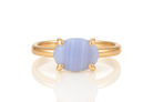 a gold ring with a blue stone on it