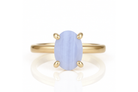 a yellow gold ring with a blue stone
