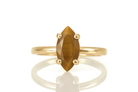 a yellow gold ring with a brown stone