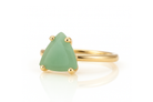 a gold ring with a green stone on it