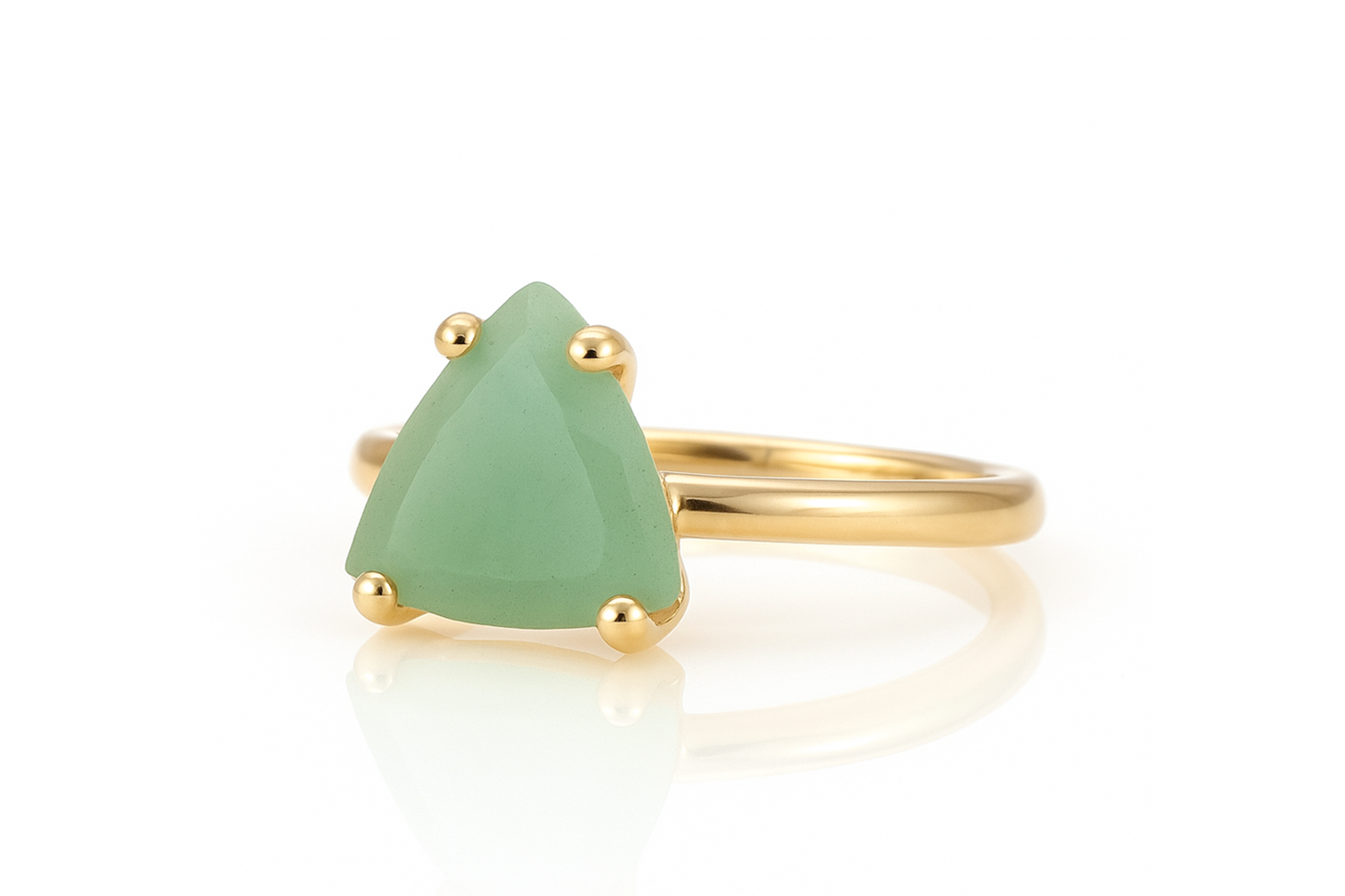 a gold ring with a green stone on it