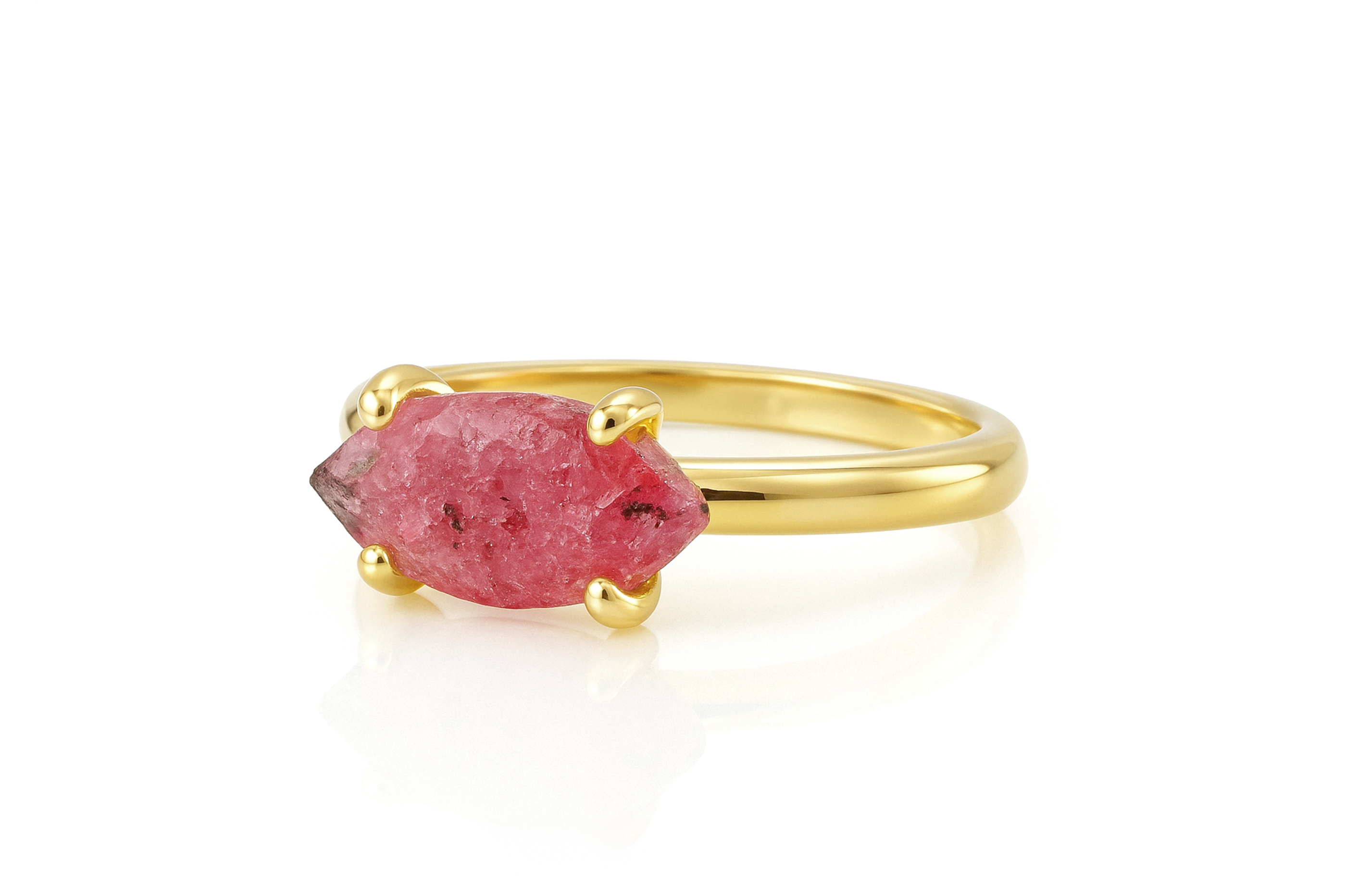a yellow gold ring with a pink stone