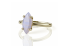a yellow gold ring with a white stone