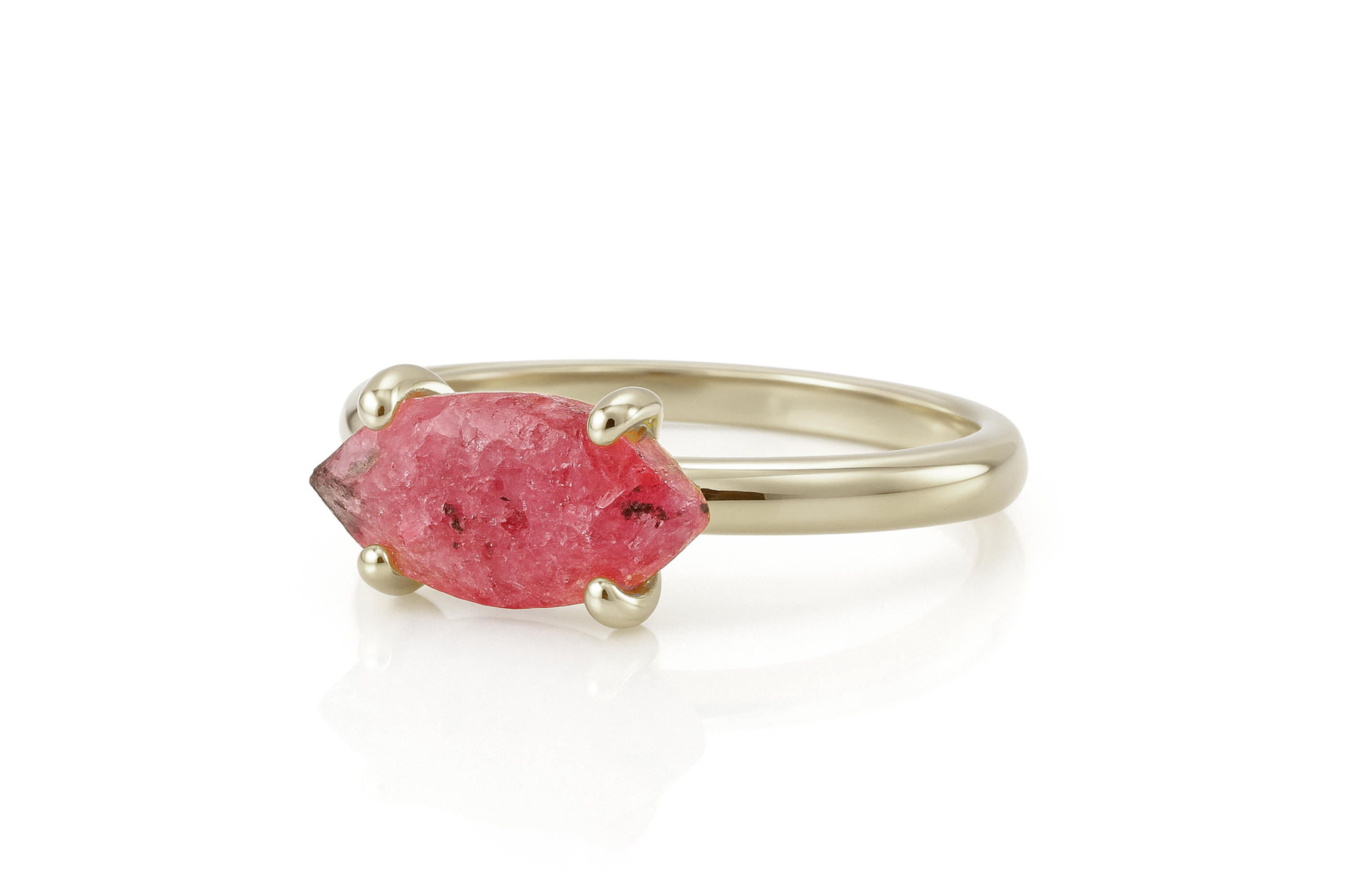 a gold ring with a pink stone in it