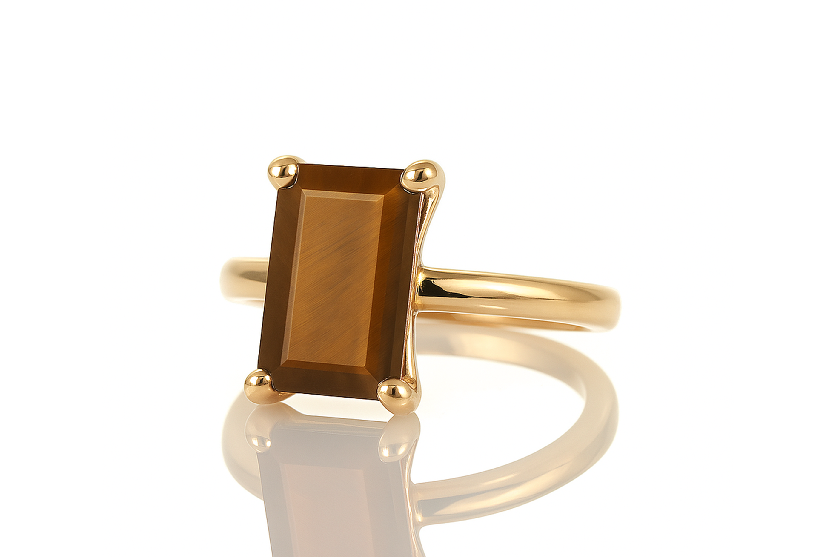 a yellow gold ring with a brown stone